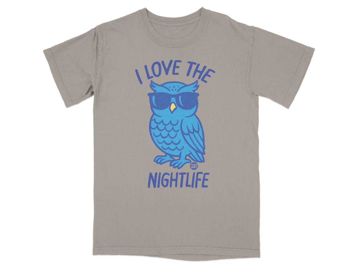 Blue owl wearing sunglasses with "I love the nightlife" text on a tan t-shirt.