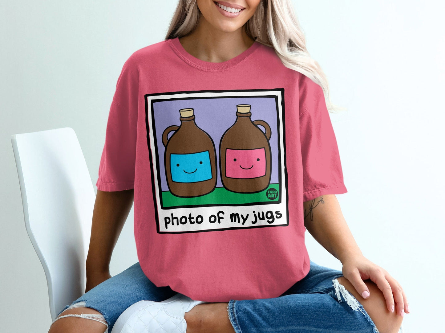 Pink t-shirt with cartoon jugs labeled "photo of my jugs".