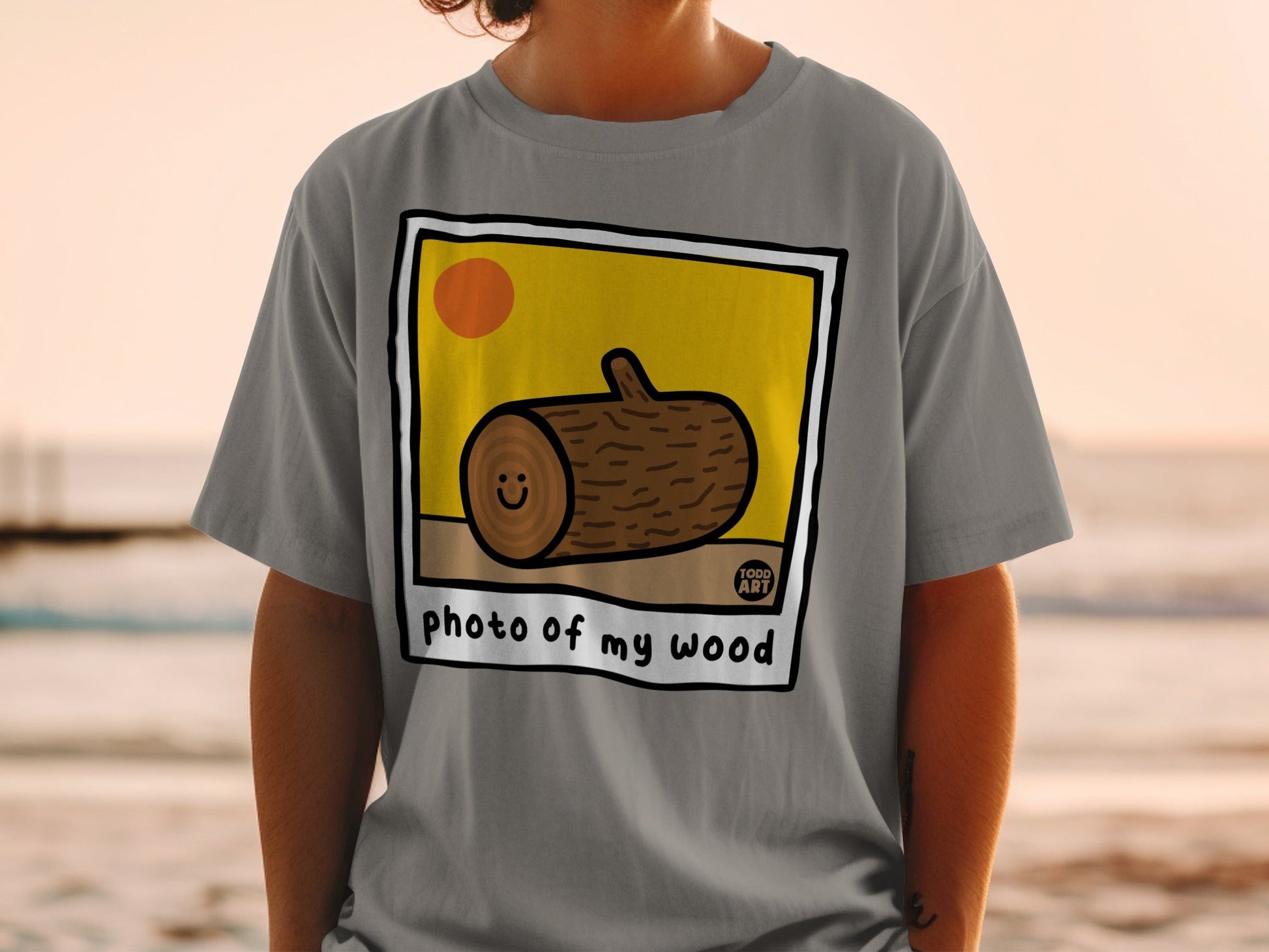 T-shirt with cartoon log illustration and "photo of my wood" text.