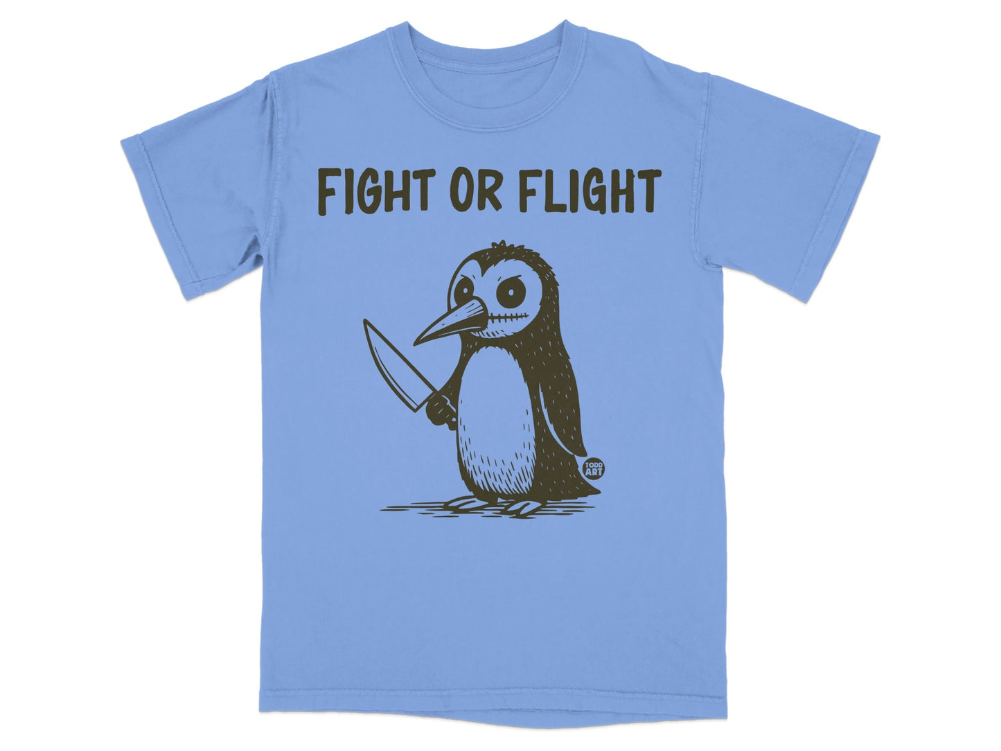 Light blue t-shirt with a cartoon penguin holding a knife, text "FIGHT OR FLIGHT".