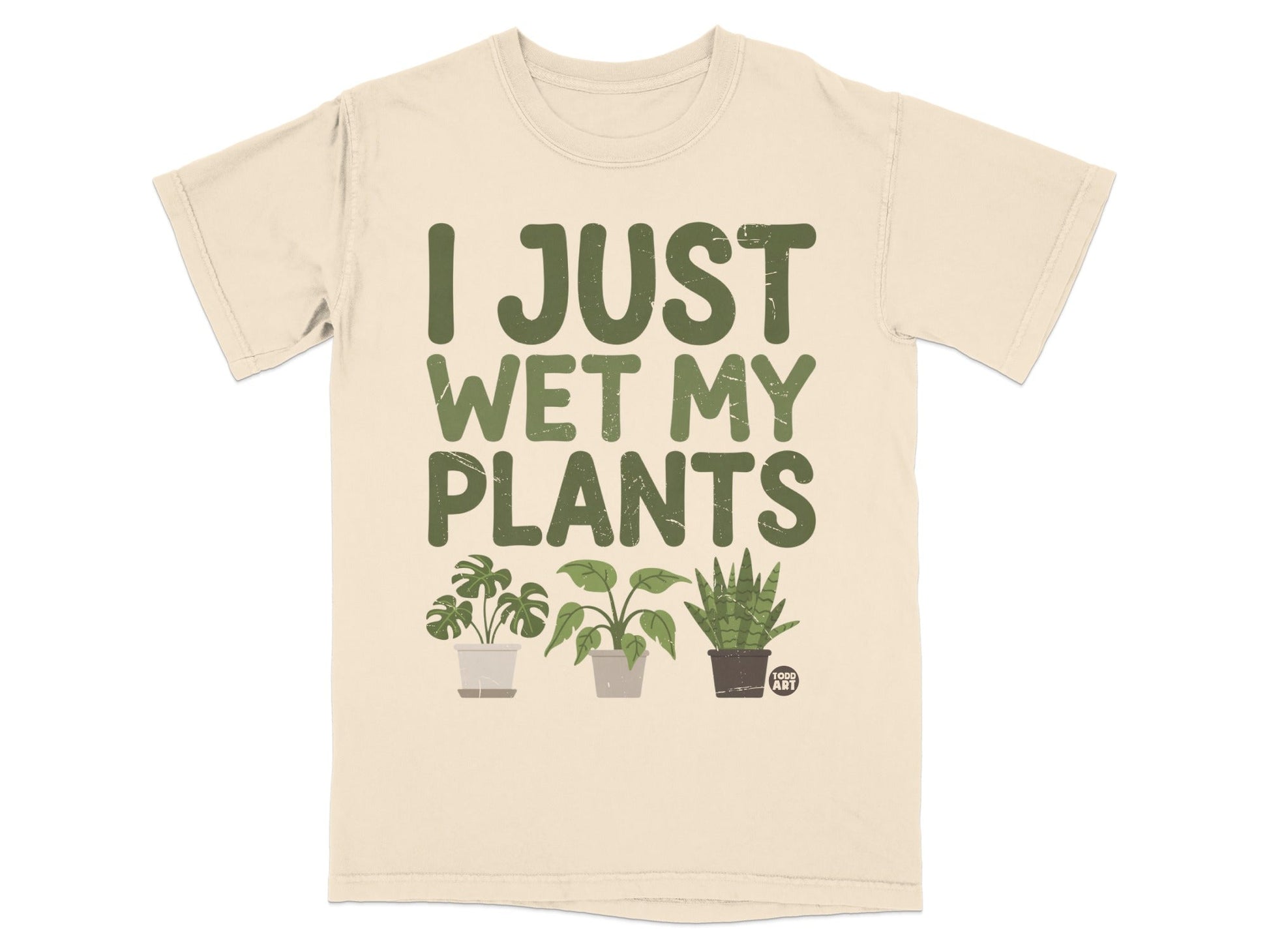 T-shirt with "I JUST WET MY PLANTS" text and three potted houseplants.