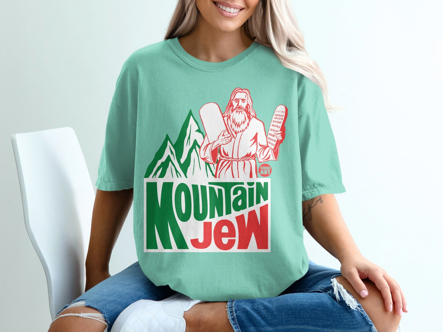 Mint green t-shirt with "MOUNTAIN JEW" in red and green lettering.