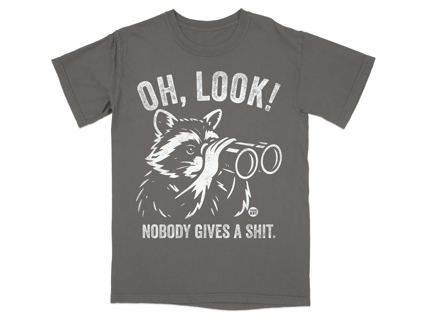 T-shirt with a raccoon looking through binoculars and text "OH, LOOK! NOBODY GIVES A SHIT."