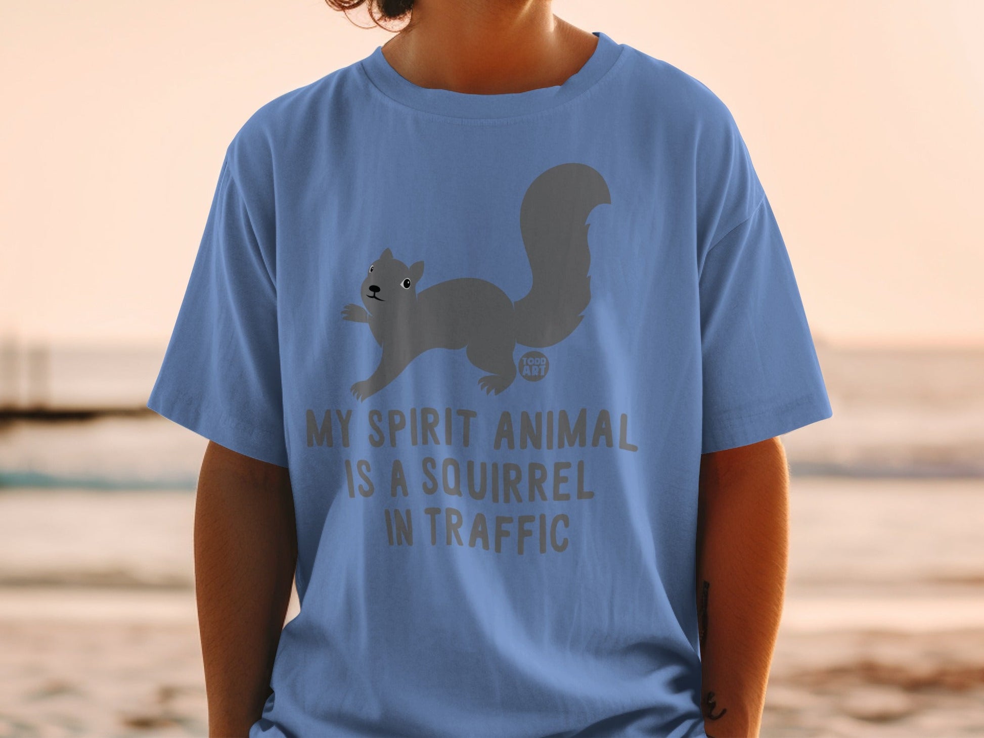 Blue t-shirt with gray squirrel graphic and text "My spirit animal is a squirrel in traffic."