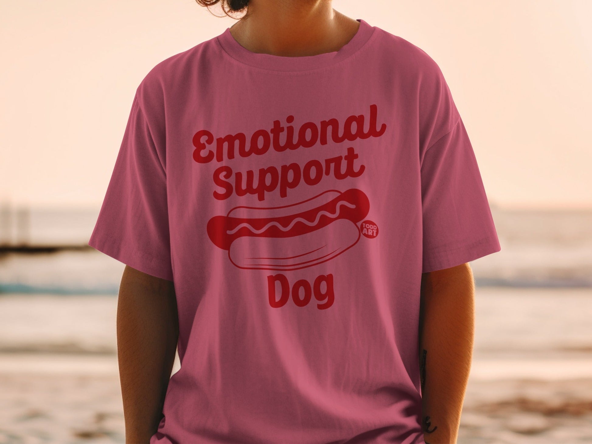 Pink t-shirt with "Emotional Support Dog" and a hot dog graphic.