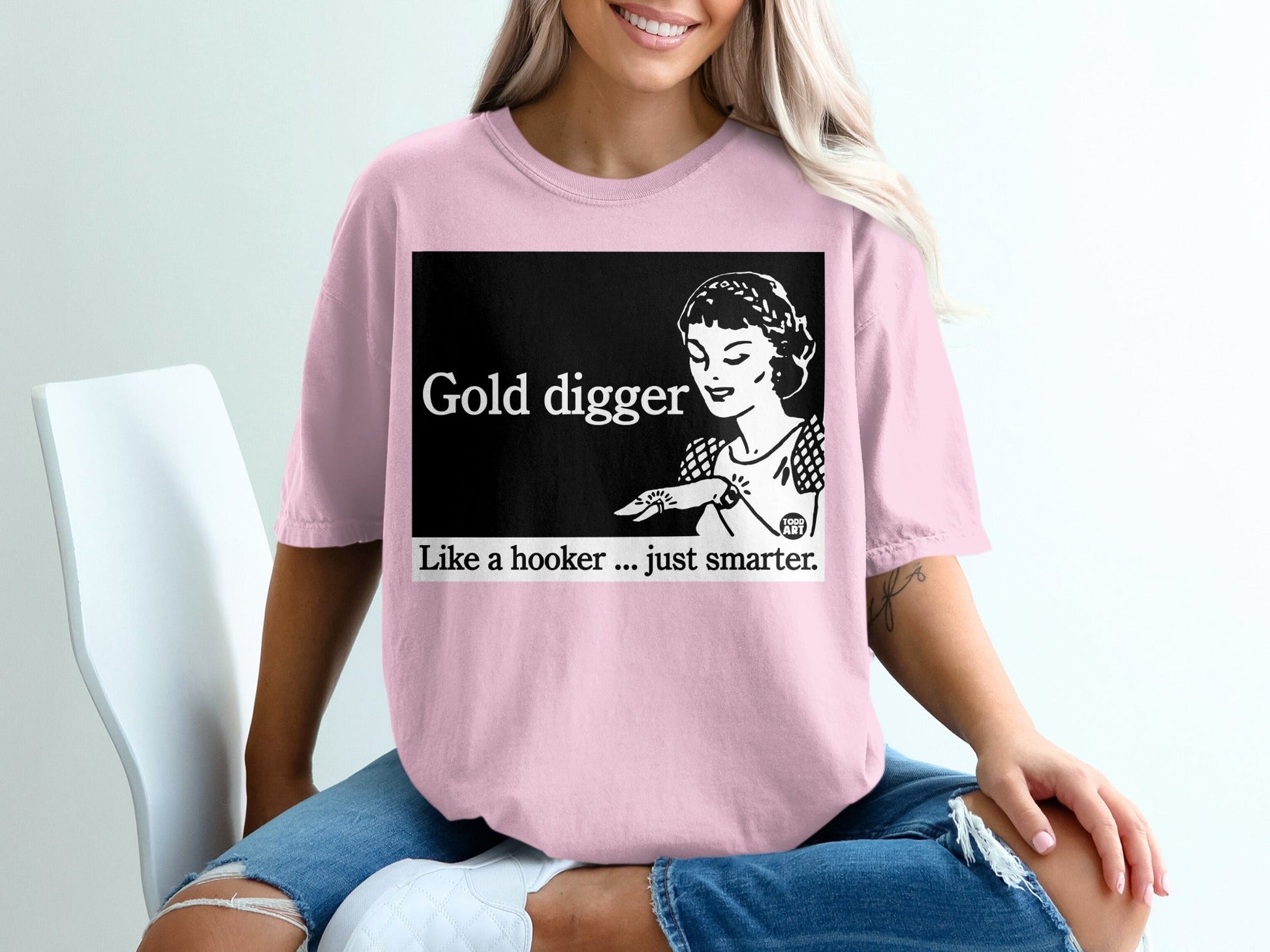 Pink t-shirt with "Gold digger Like a hooker... just smarter" graphic and retro woman.