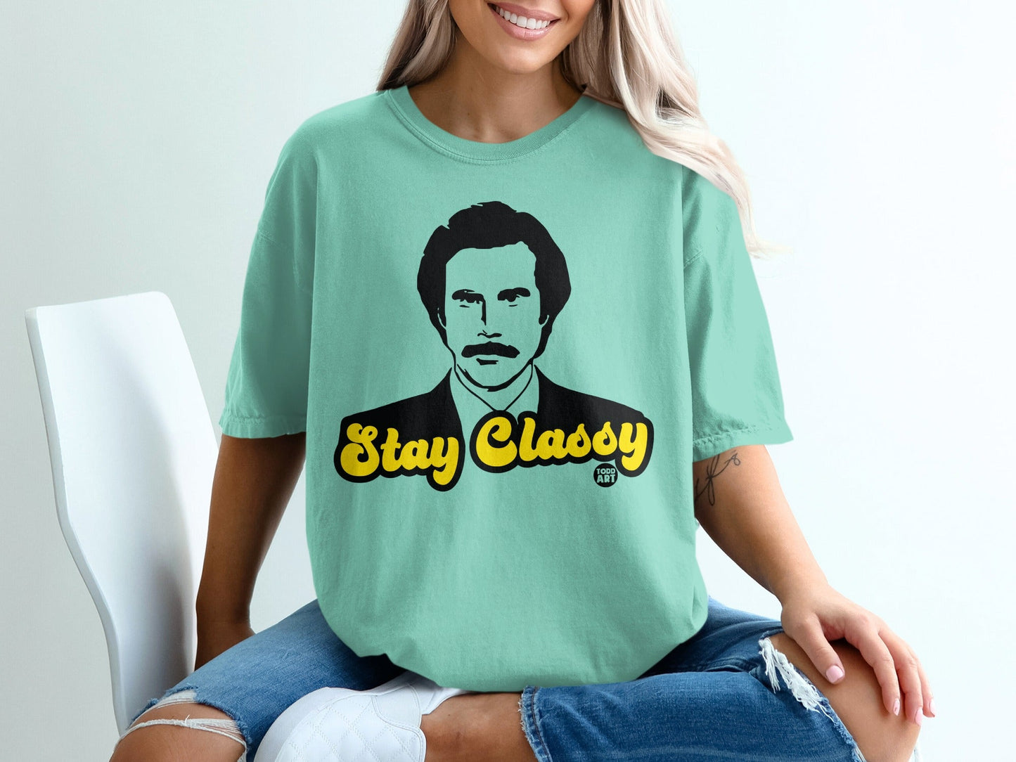 Mint t-shirt with "Stay Classy" text in yellow and black.