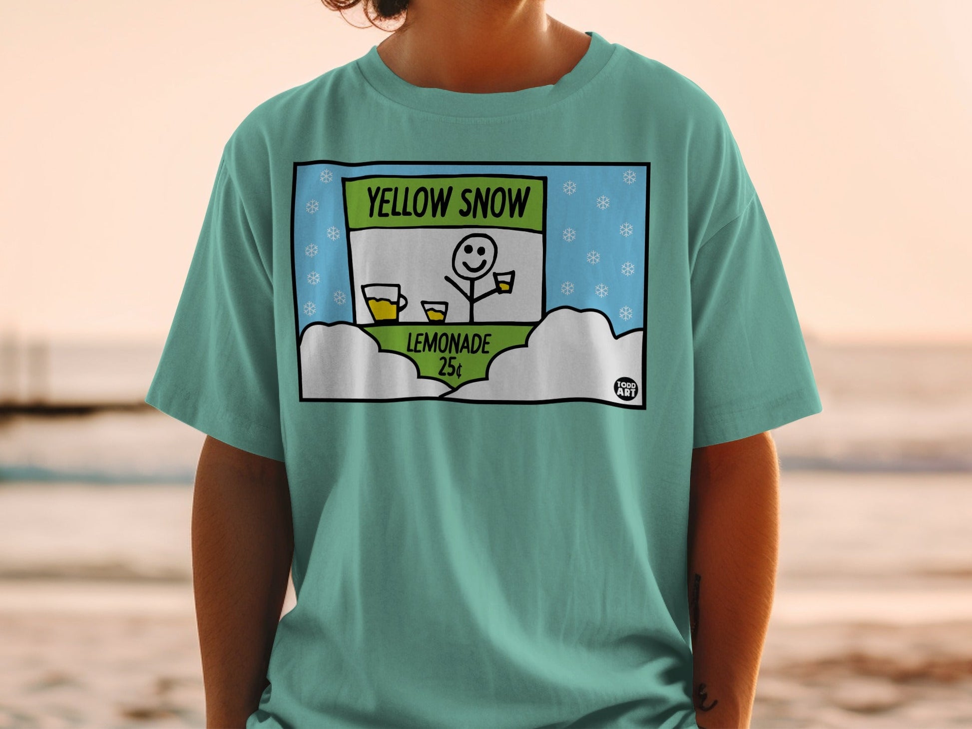 T-shirt graphic: "Yellow Snow" lemonade stand with smiling snowman, 25 cents.