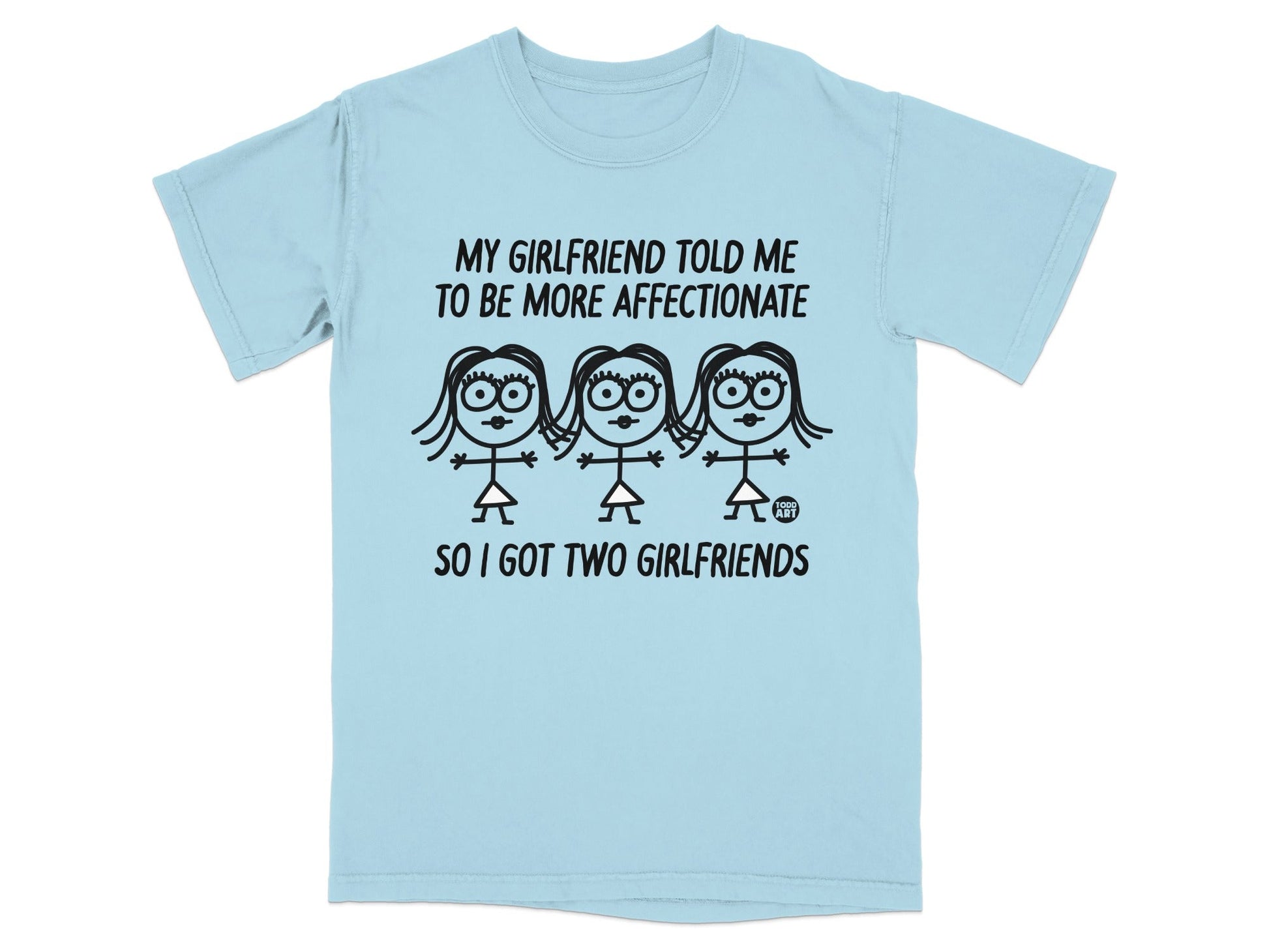 Light blue t-shirt with "MY GIRLFRIEND TOLD ME TO BE MORE AFFECTIONATE SO I GOT TWO GIRLFRIENDS" text and cartoon figures.