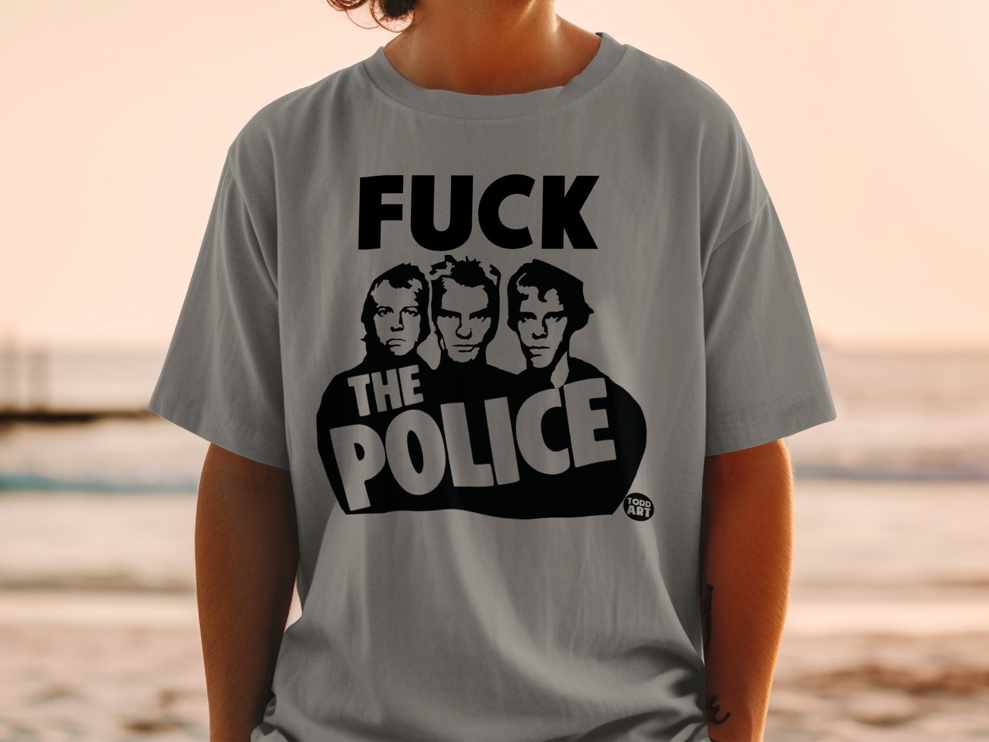 Gray t-shirt with "FUCK THE POLICE" and three band members.