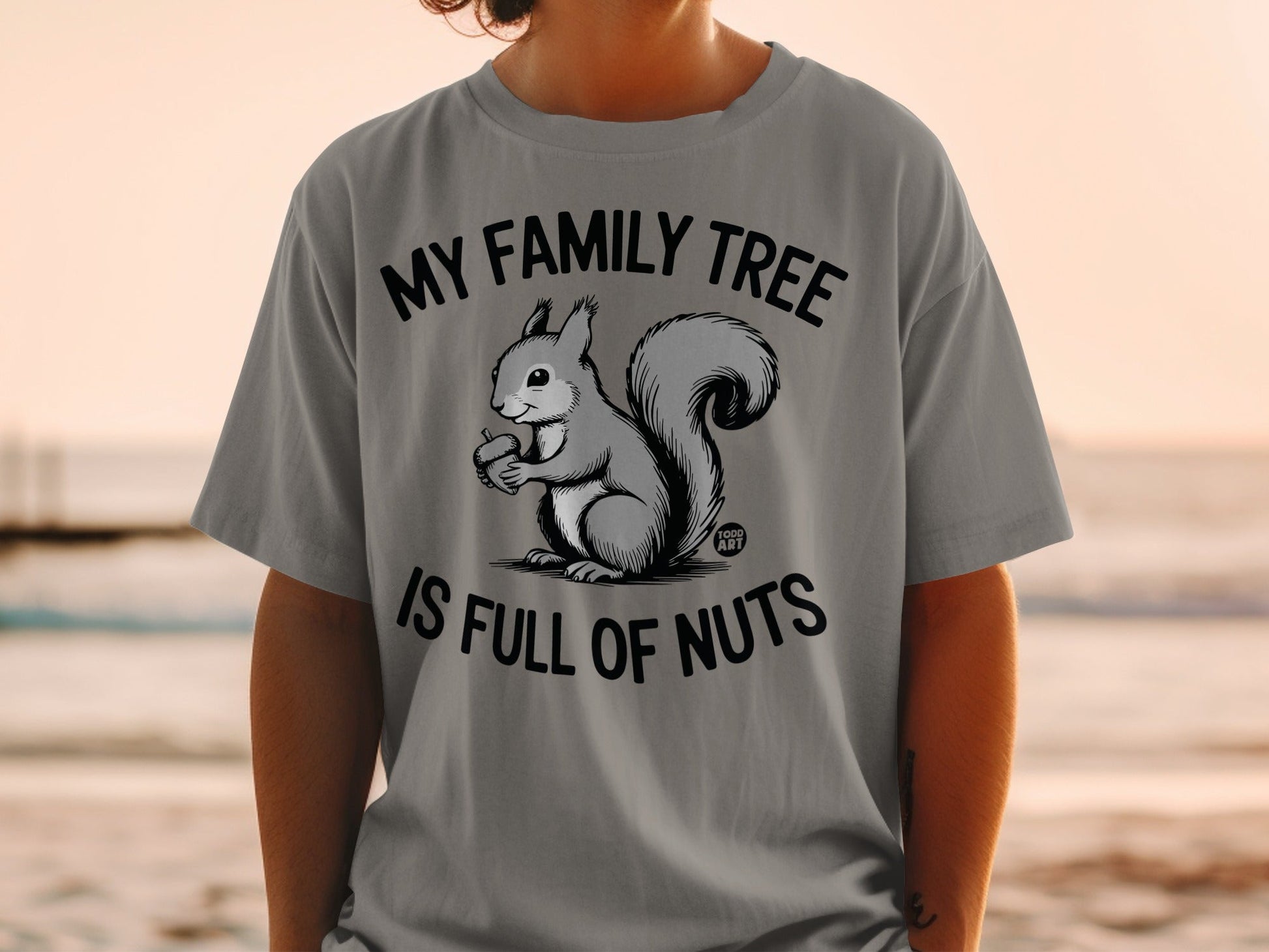 Squirrel holding acorn with text "MY FAMILY TREE IS FULL OF NUTS".