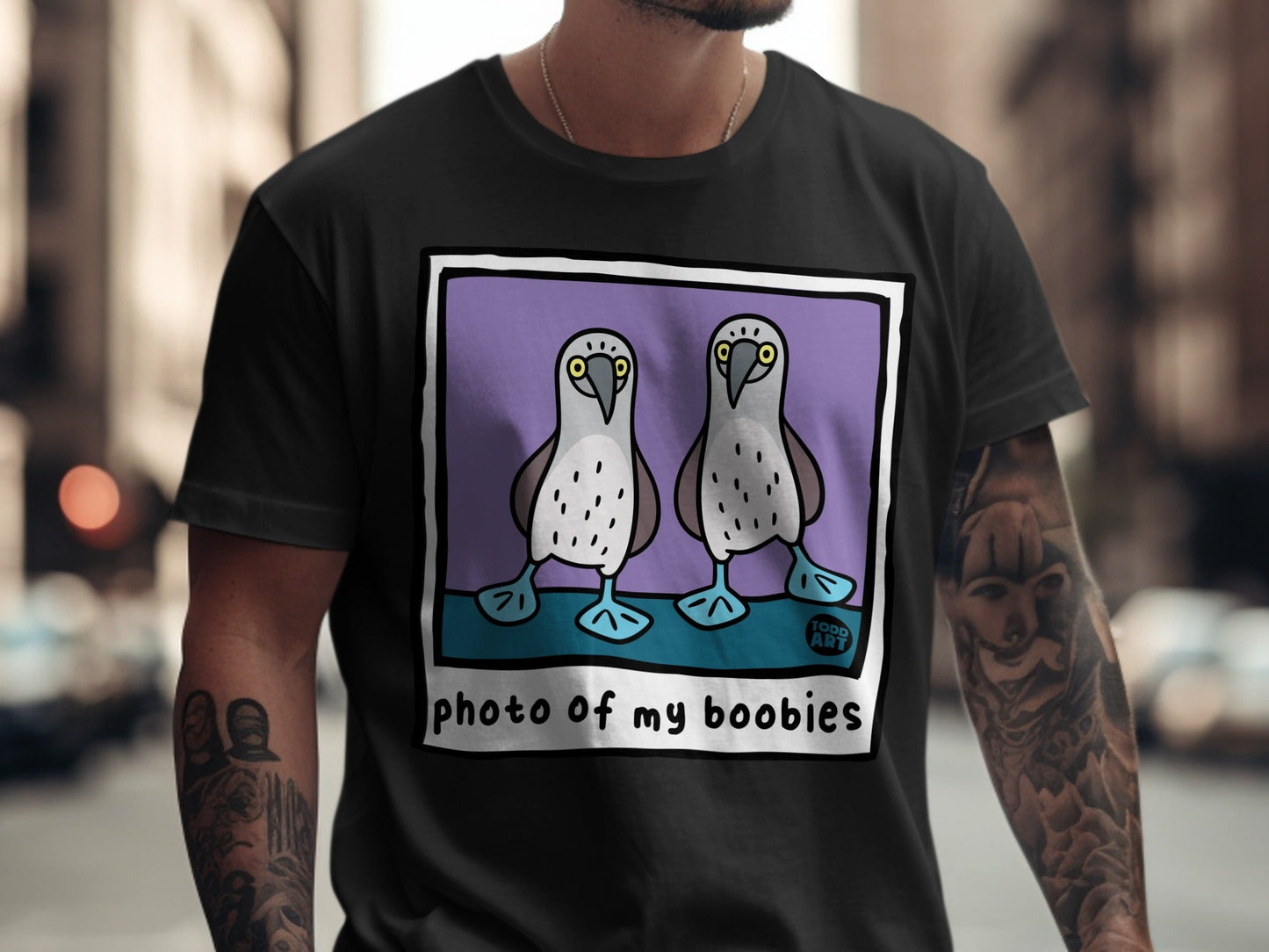 Two cartoon boobies on a purple background, with text "photo of my boobies" and "TODD ART".