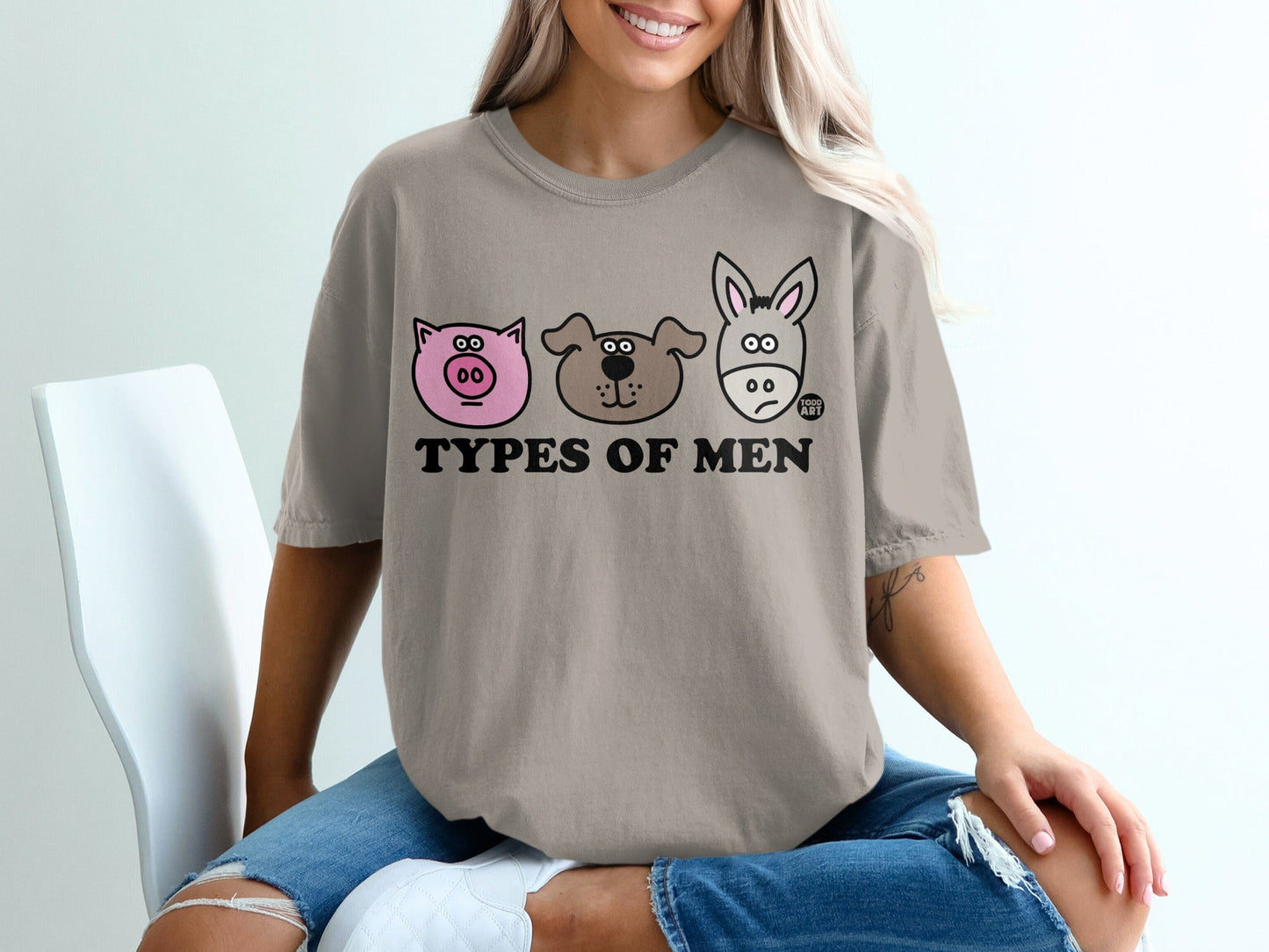 T-shirt with cartoon pig, dog, and donkey faces and the words "Types of Men".