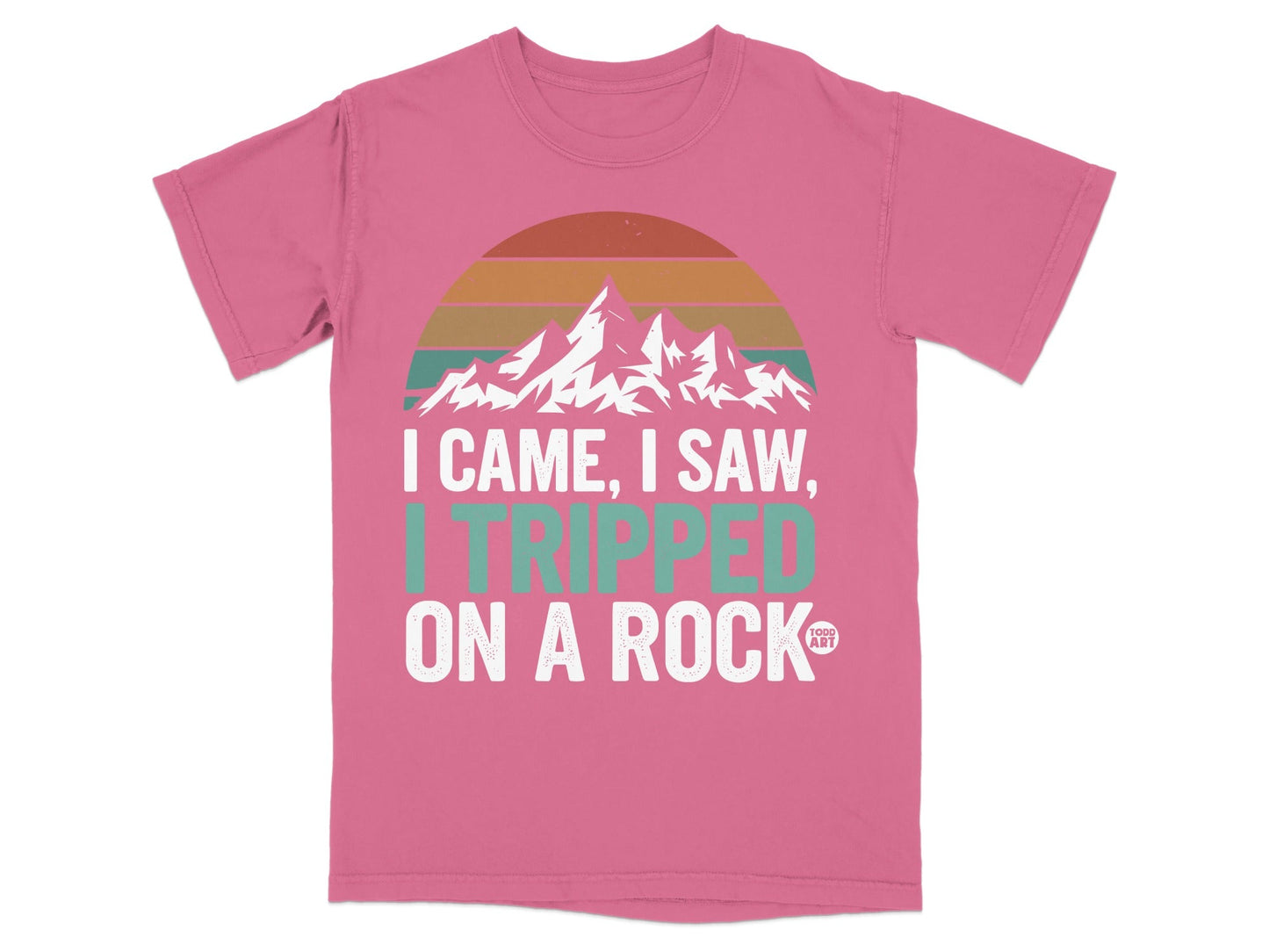 Pink t-shirt with "I Came, I Saw, I Tripped on a Rock" text and mountains.