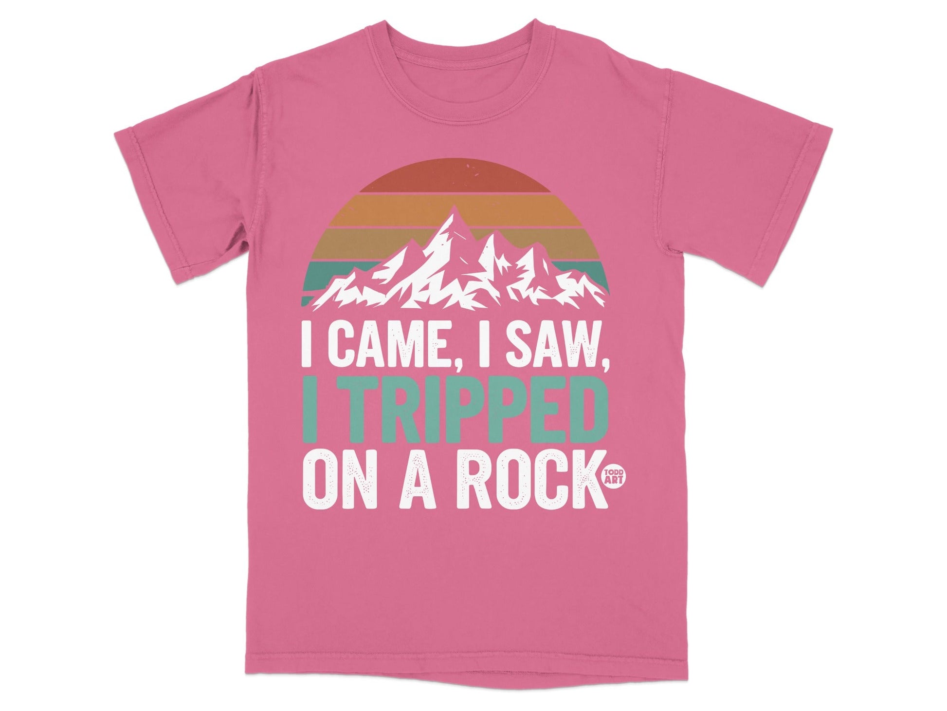 Pink t-shirt with "I Came, I Saw, I Tripped on a Rock" text and mountains.