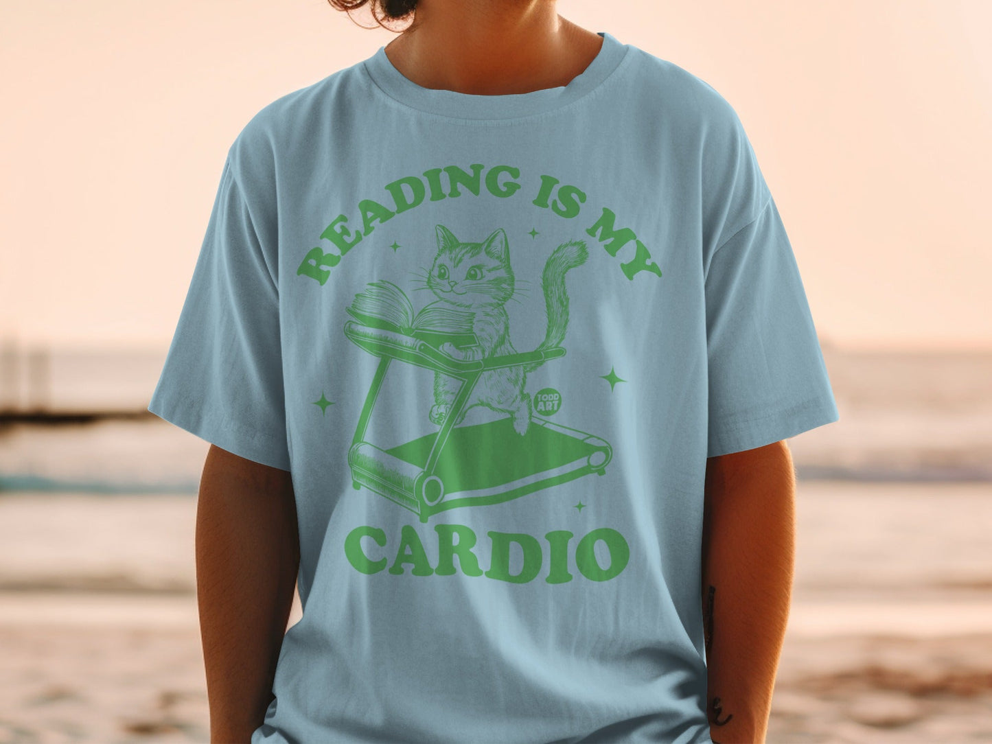 Reading Is My Cardio Cat on Treadmill Graphic Tee