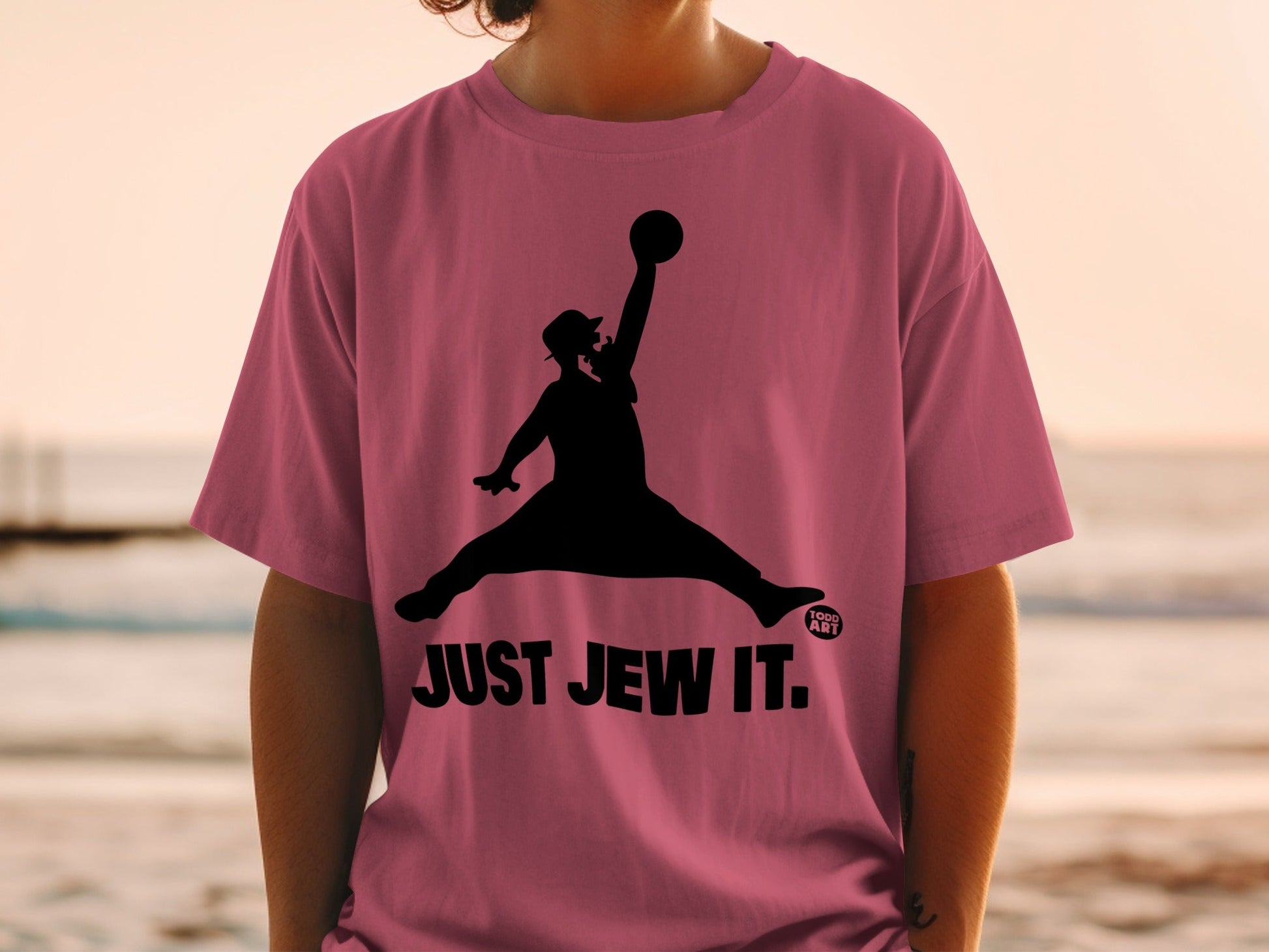 Silhouette of a man jumping with a basketball, text "JUST JEW IT."
