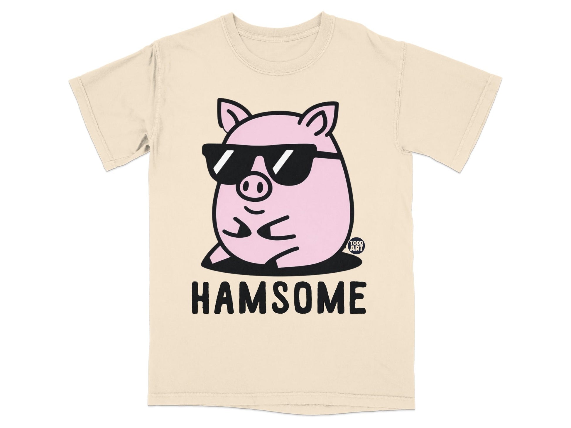 Pink pig wearing sunglasses on a beige t-shirt with "HAMSOME" text.