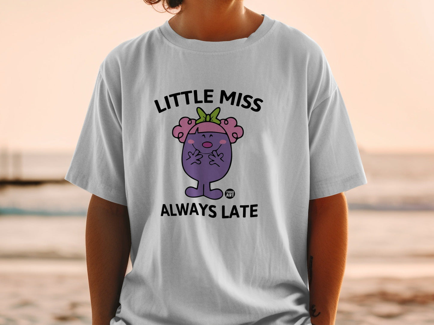 White t-shirt with Little Miss Always Late cartoon character.