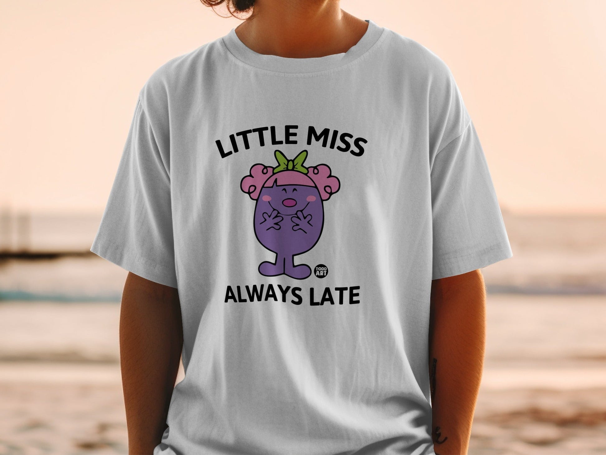 White t-shirt with Little Miss Always Late cartoon character.
