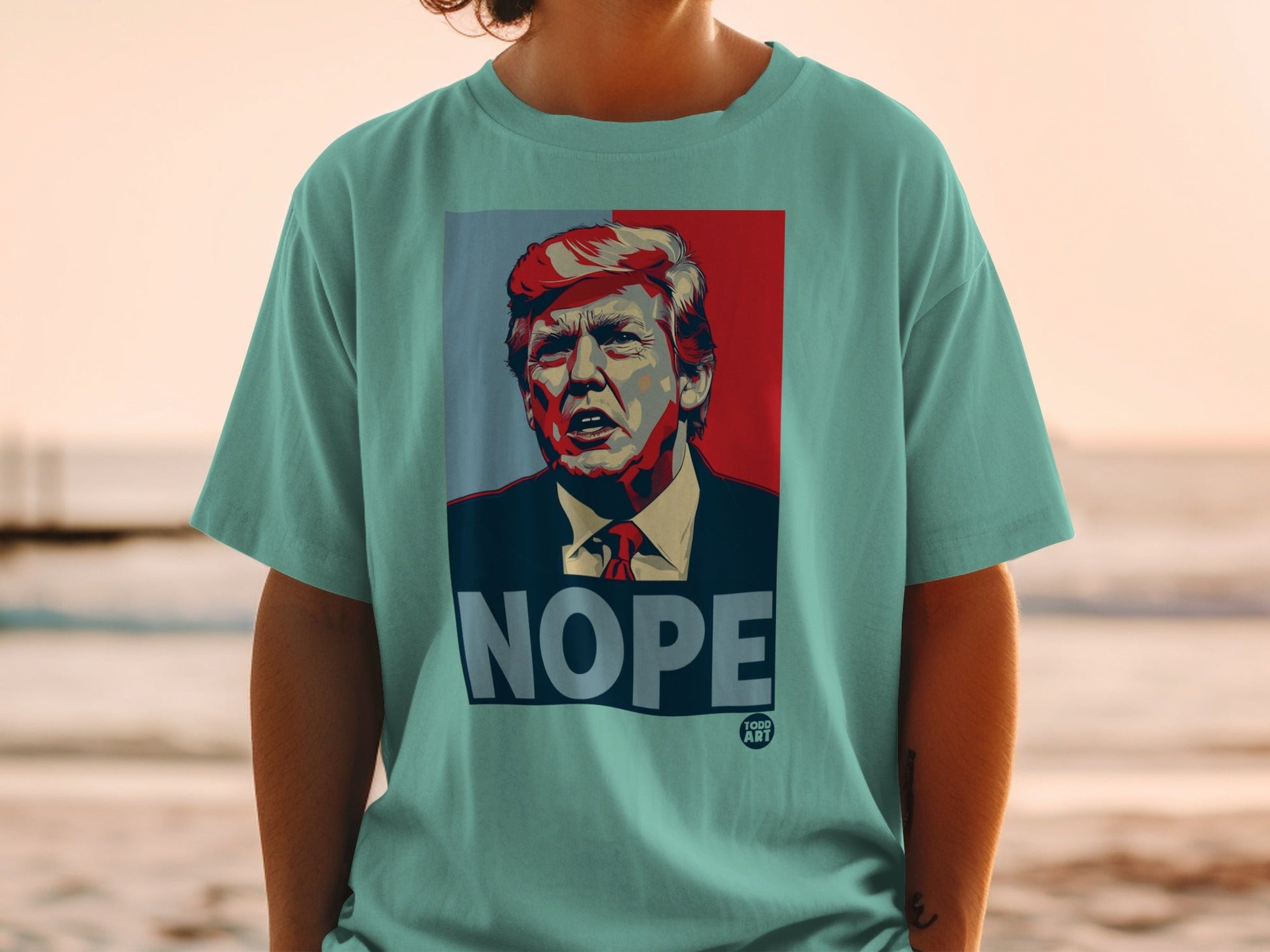 T-shirt featuring a portrait of Donald Trump with the word "NOPE" below.