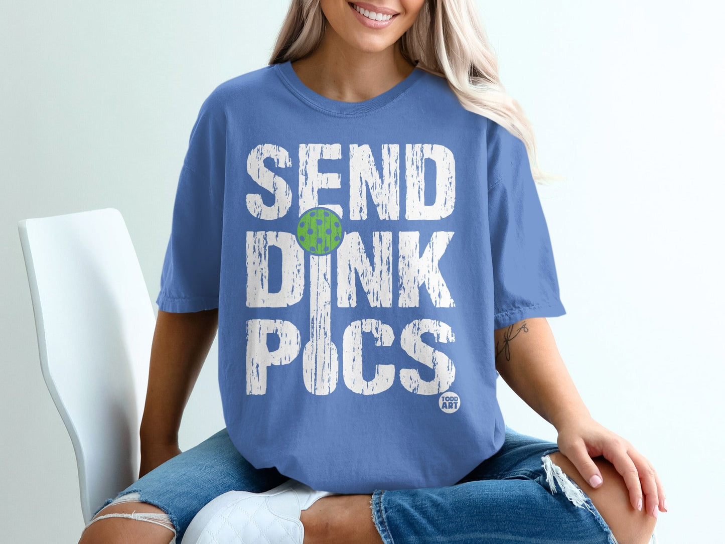 Blue t-shirt with distressed "SEND DINK PICS" text and pickleball graphic.