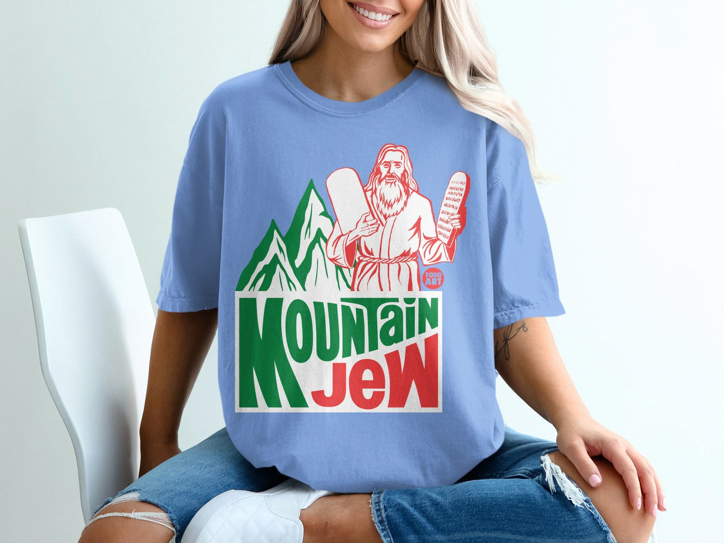 Light blue t-shirt with "Mountain Jew" text and Jesus holding stone tablets.