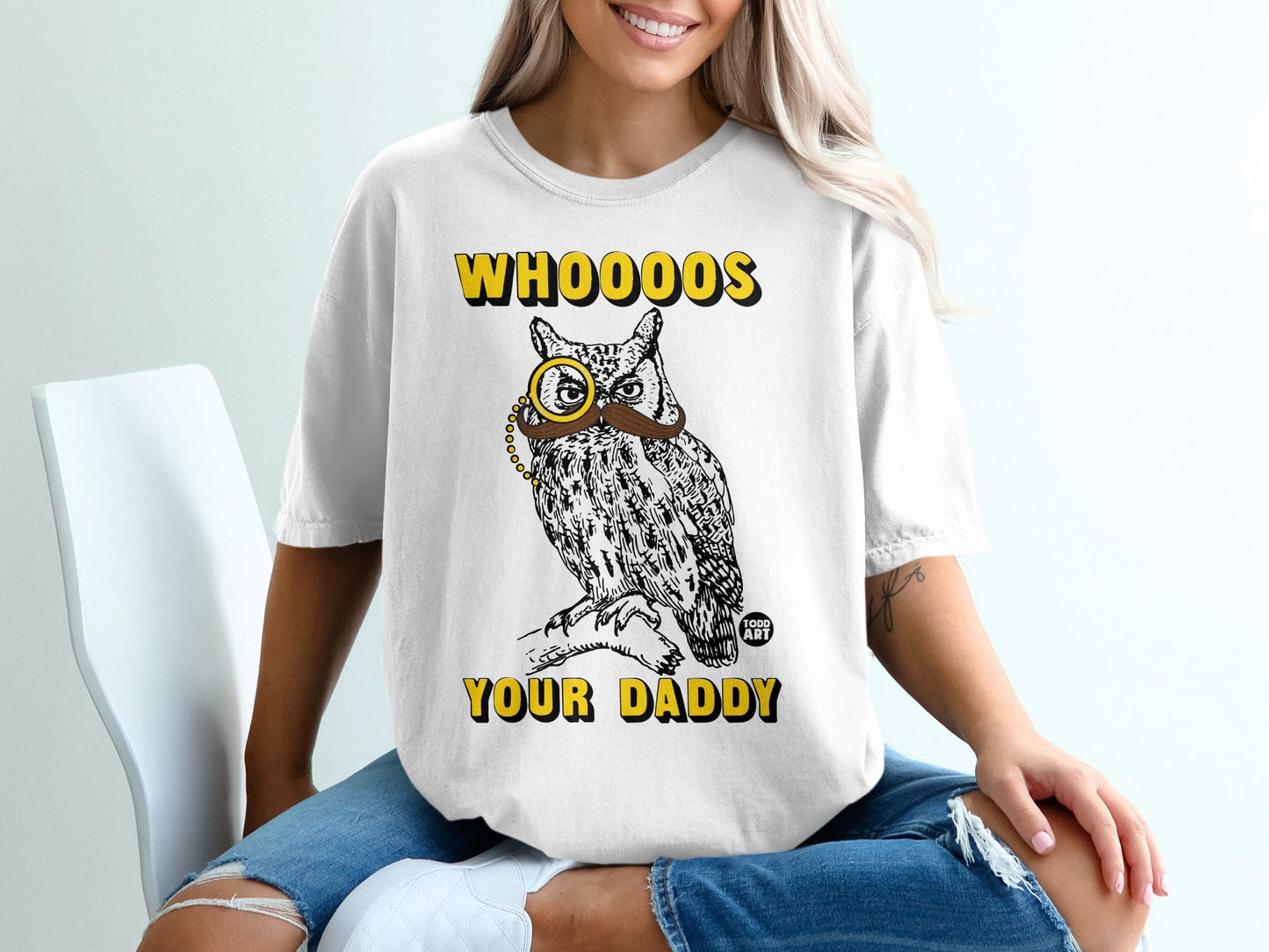 Graphic tee with text "WHOOOOS YOUR DADDY" and owl wearing monocle.