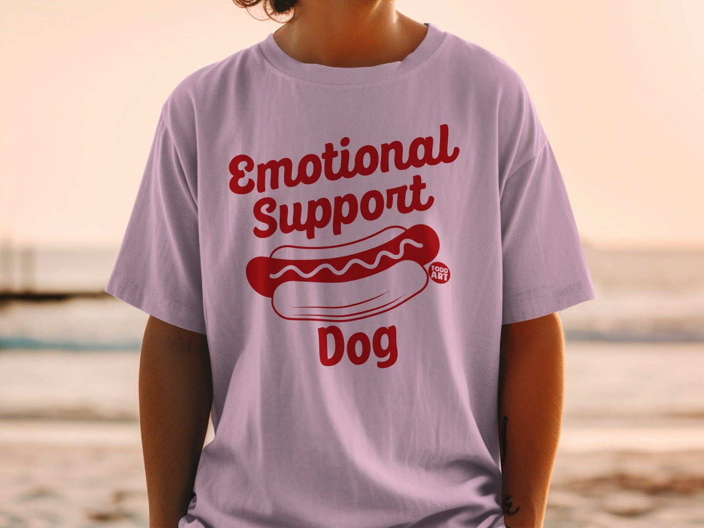 Pink t-shirt with "Emotional Support Dog" and hot dog graphic.