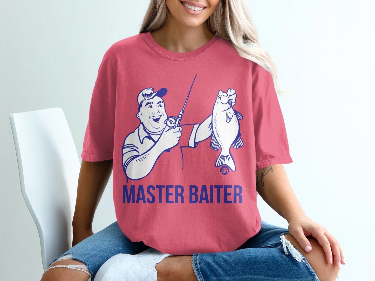 Salmon pink t-shirt with "MASTER BAITER" text and cartoon fisherman holding a fish.