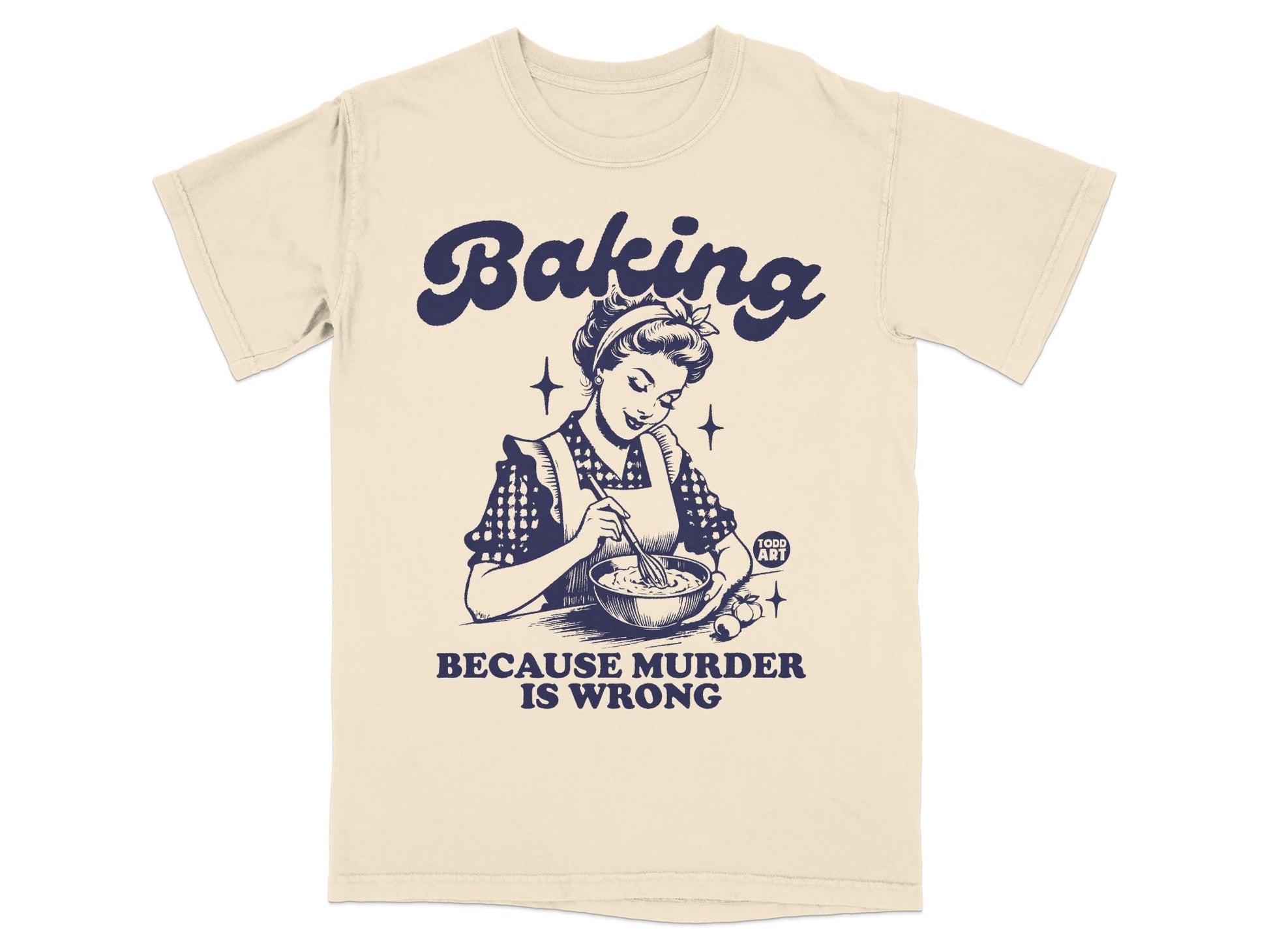 Cream t-shirt with "Baking Because Murder Is Wrong" and a woman baking.