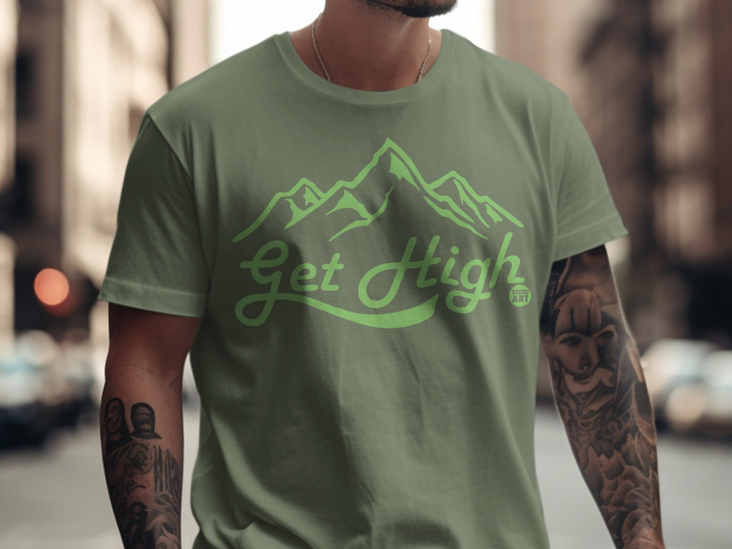Olive green t-shirt with "Get High" and mountain graphic.