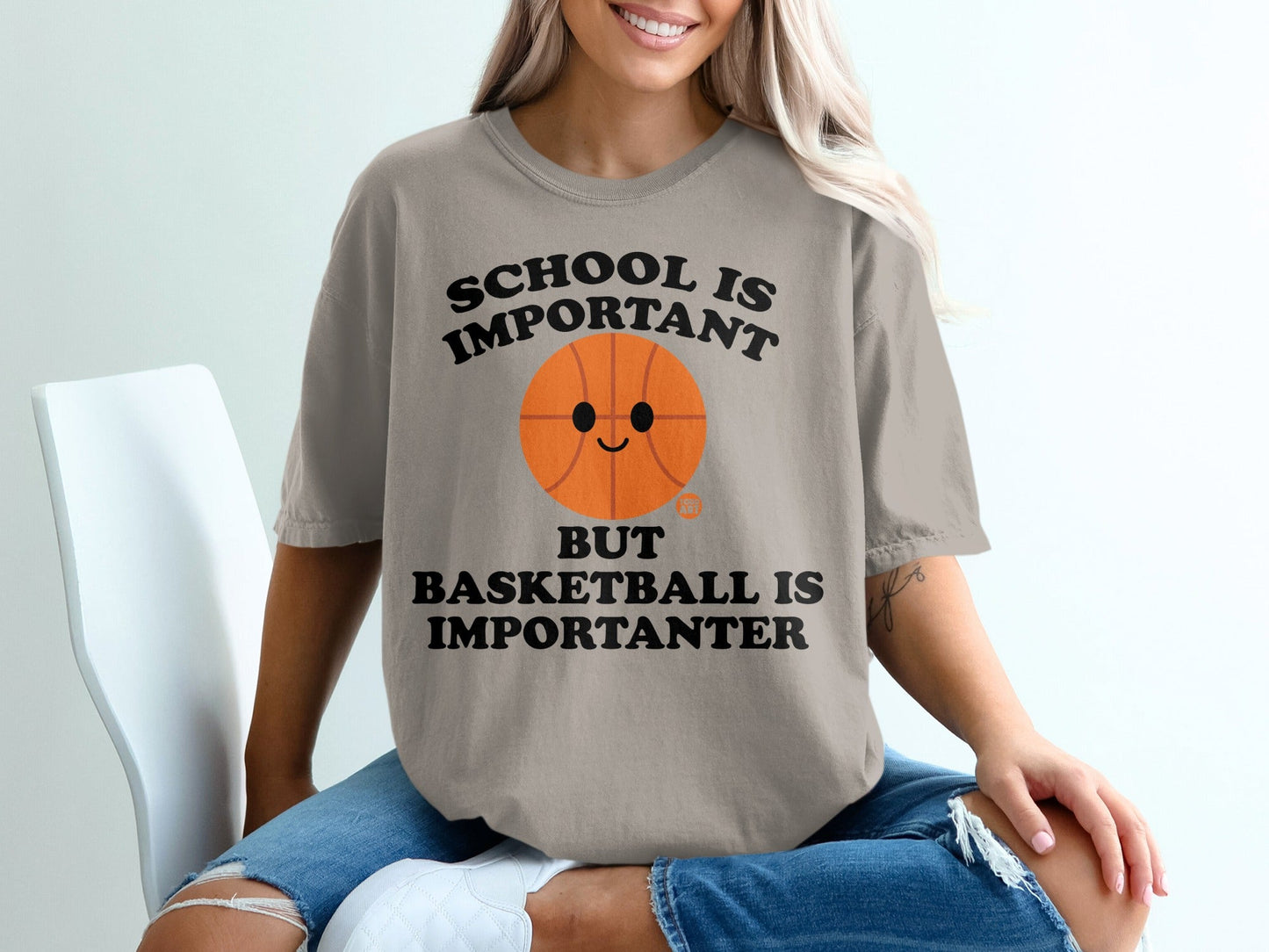 T-shirt with "SCHOOL IS IMPORTANT BUT BASKETBALL IS IMPORTANTER" and a smiling basketball.