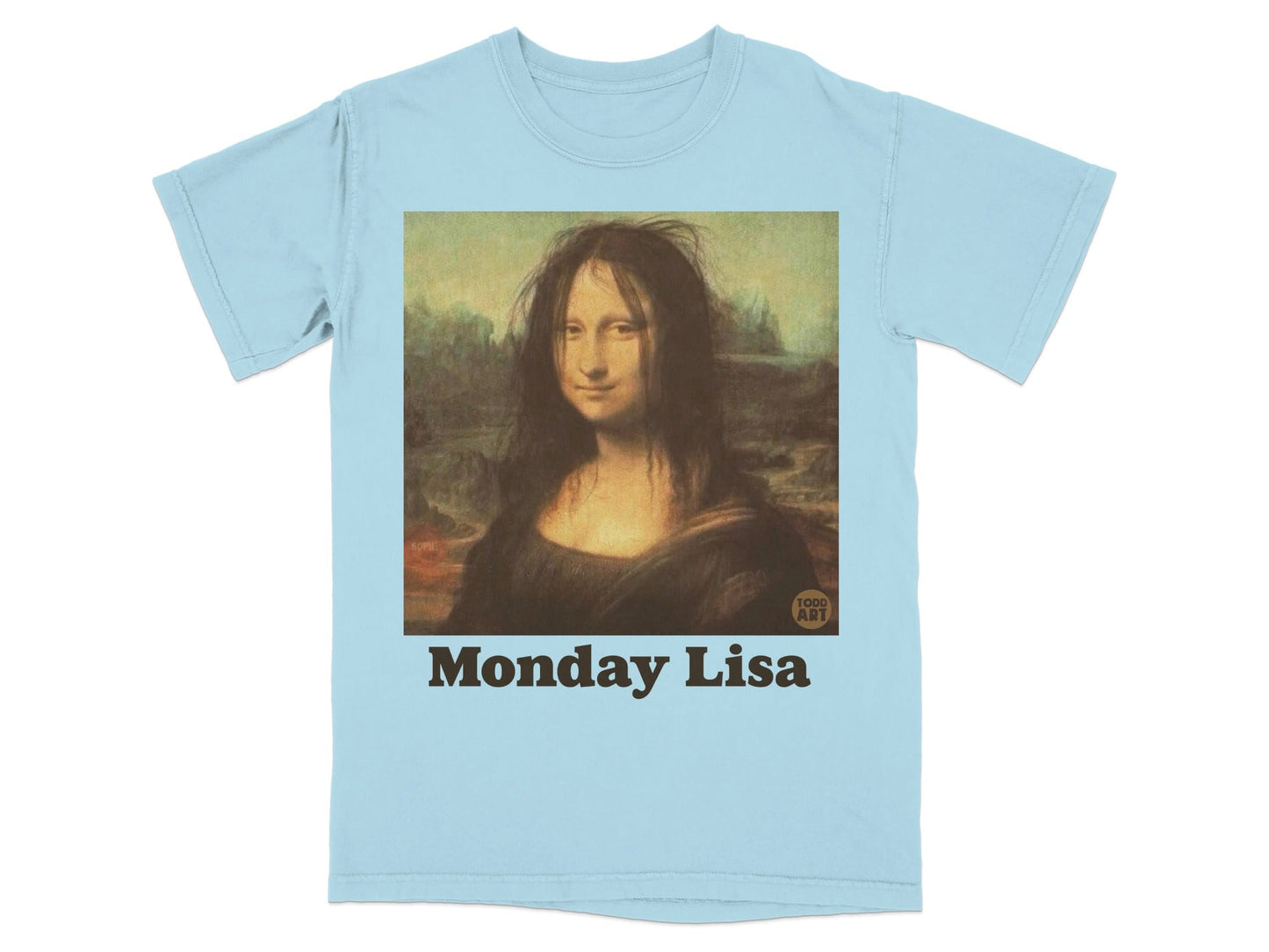 Light blue t-shirt featuring the Mona Lisa with messy hair and the text "TODD AMI" and "Monday Lisa".