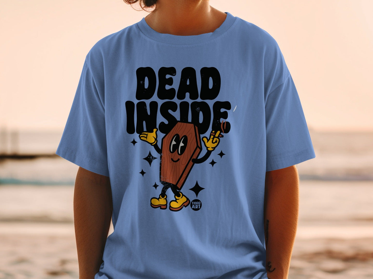 Blue t-shirt with cartoon coffin character saying "DEAD INSIDE"