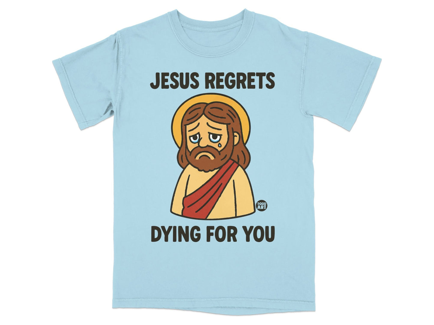 Light blue t-shirt with cartoon Jesus saying "JESUS REGRETS DYING FOR YOU".