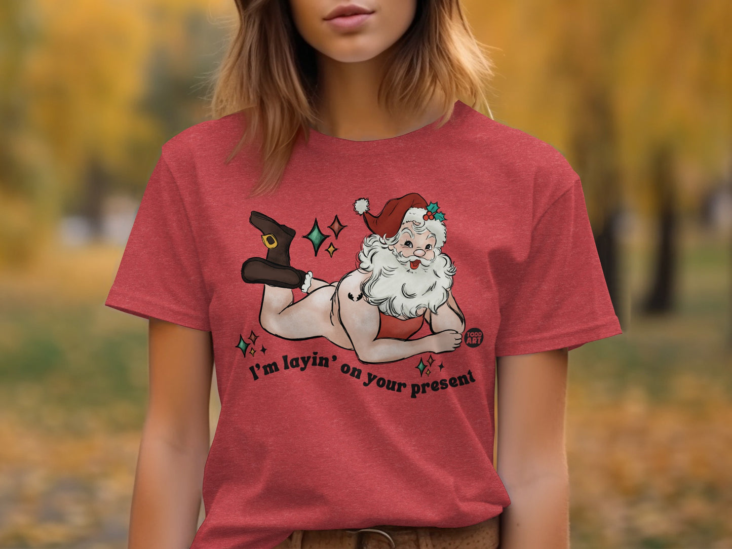 Santa Claus Laying on Present Graphic Holiday T-Shirt