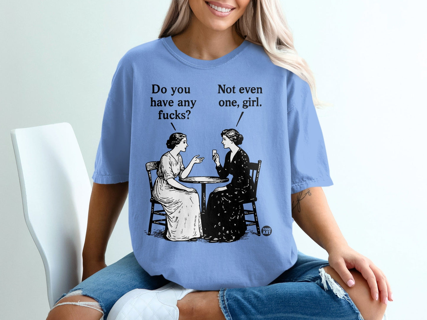 Illustration of two women at a table with text "Do you have any fucks?" and "Not even one, girl."