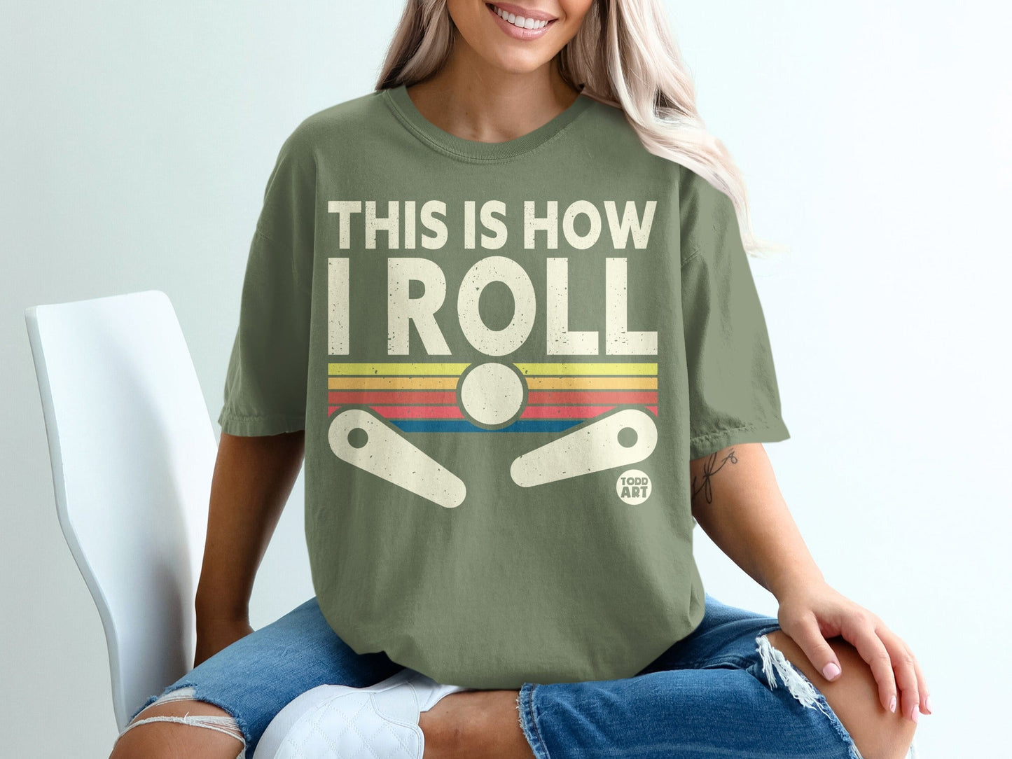 Green t-shirt with "THIS IS HOW I ROLL" and pinball design.