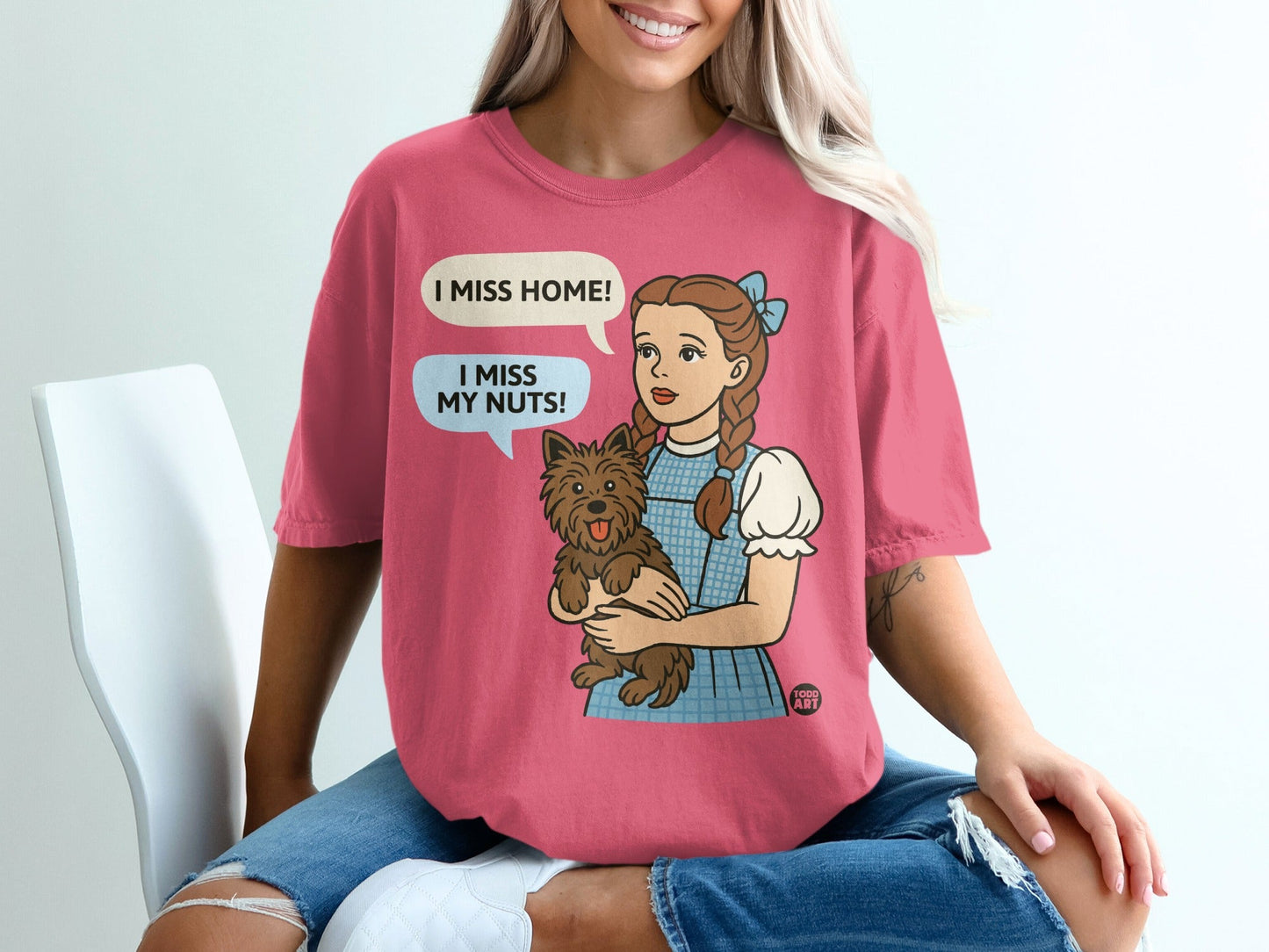 Dorothy from Wizard of Oz holding Toto, text bubble "I MISS HOME! I MISS MY NUTS!"