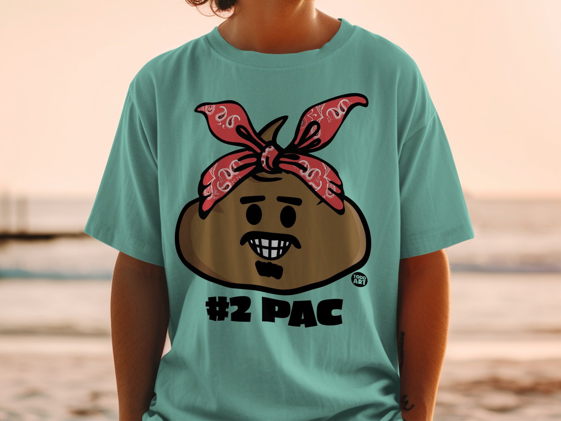 Turquoise t-shirt with a cartoon poop character wearing a red bandana and the text "#2 PAC".