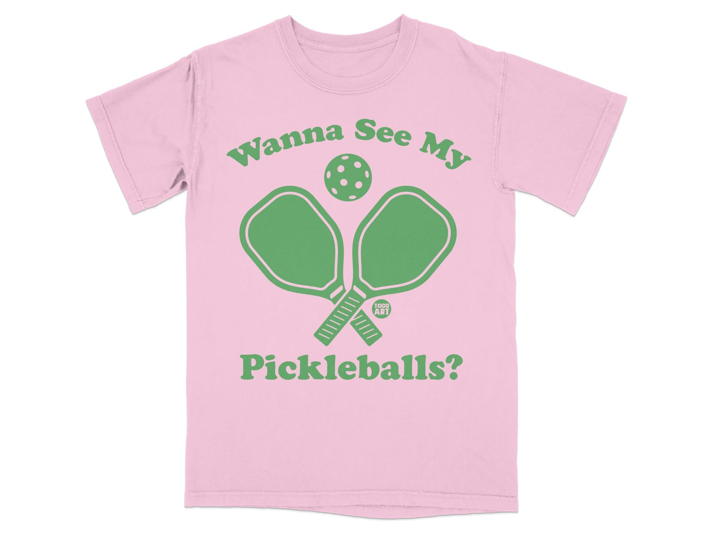 Pink t-shirt with green pickleball paddles and ball, text "Wanna See My Pickleballs?".