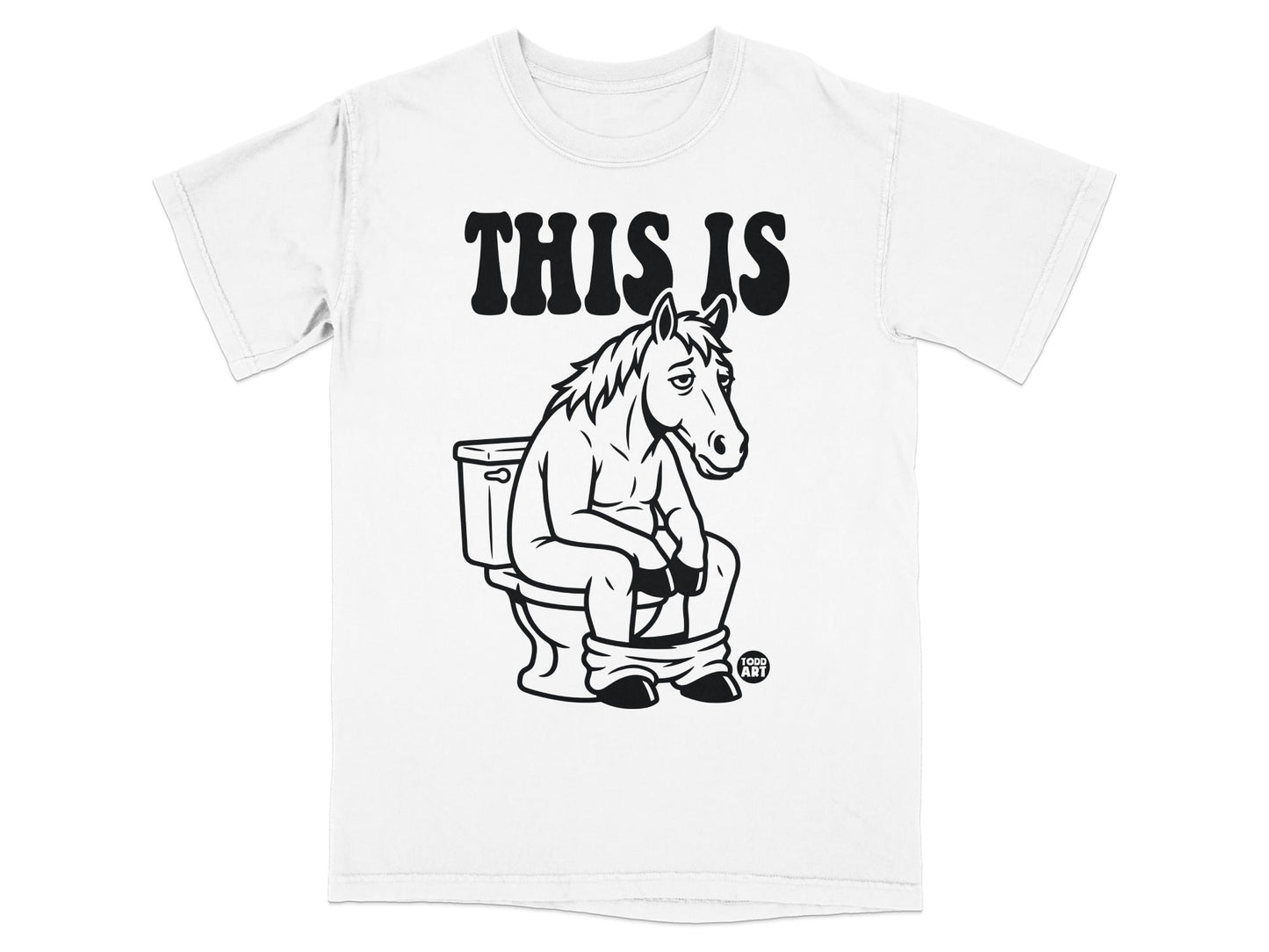 White t-shirt with "THIS IS" and a horse sitting on a toilet.