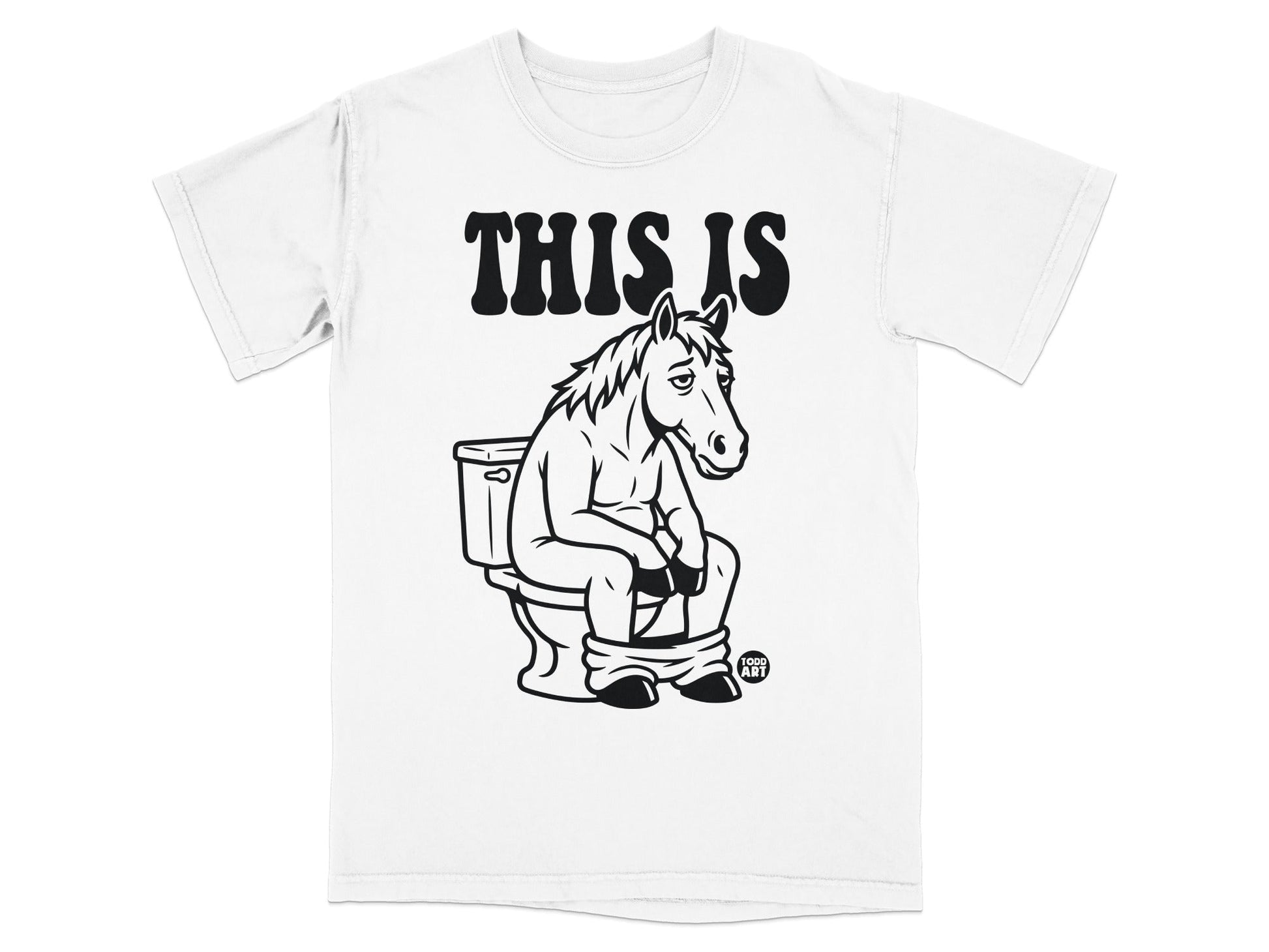 White t-shirt with "THIS IS" and a horse sitting on a toilet.