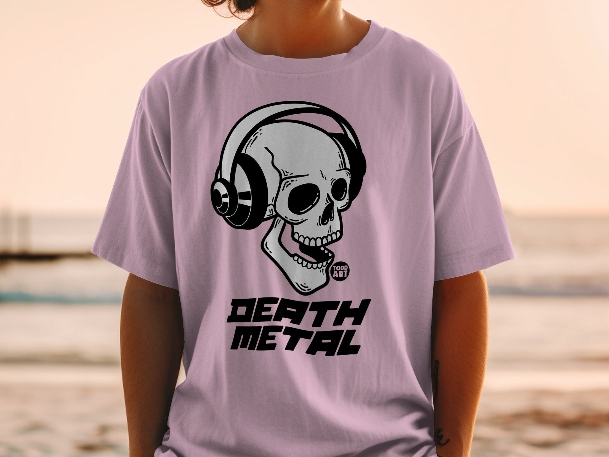 Pink t-shirt with skull wearing headphones and "DEATH METAL" text.