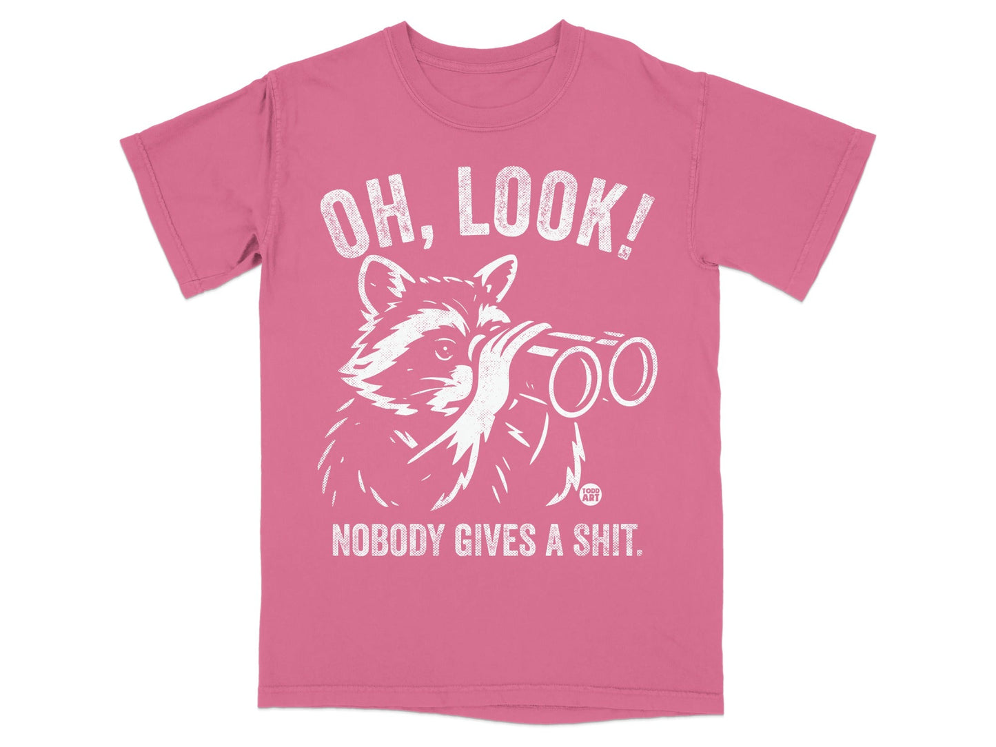 Pink t-shirt with a raccoon looking through binoculars and text "OH, LOOK! NOBODY GIVES A SHIT."