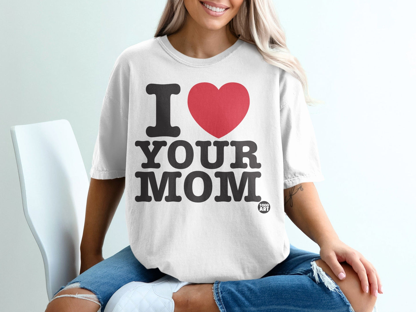 White t-shirt with red heart and "I LOVE YOUR MOM" text.
