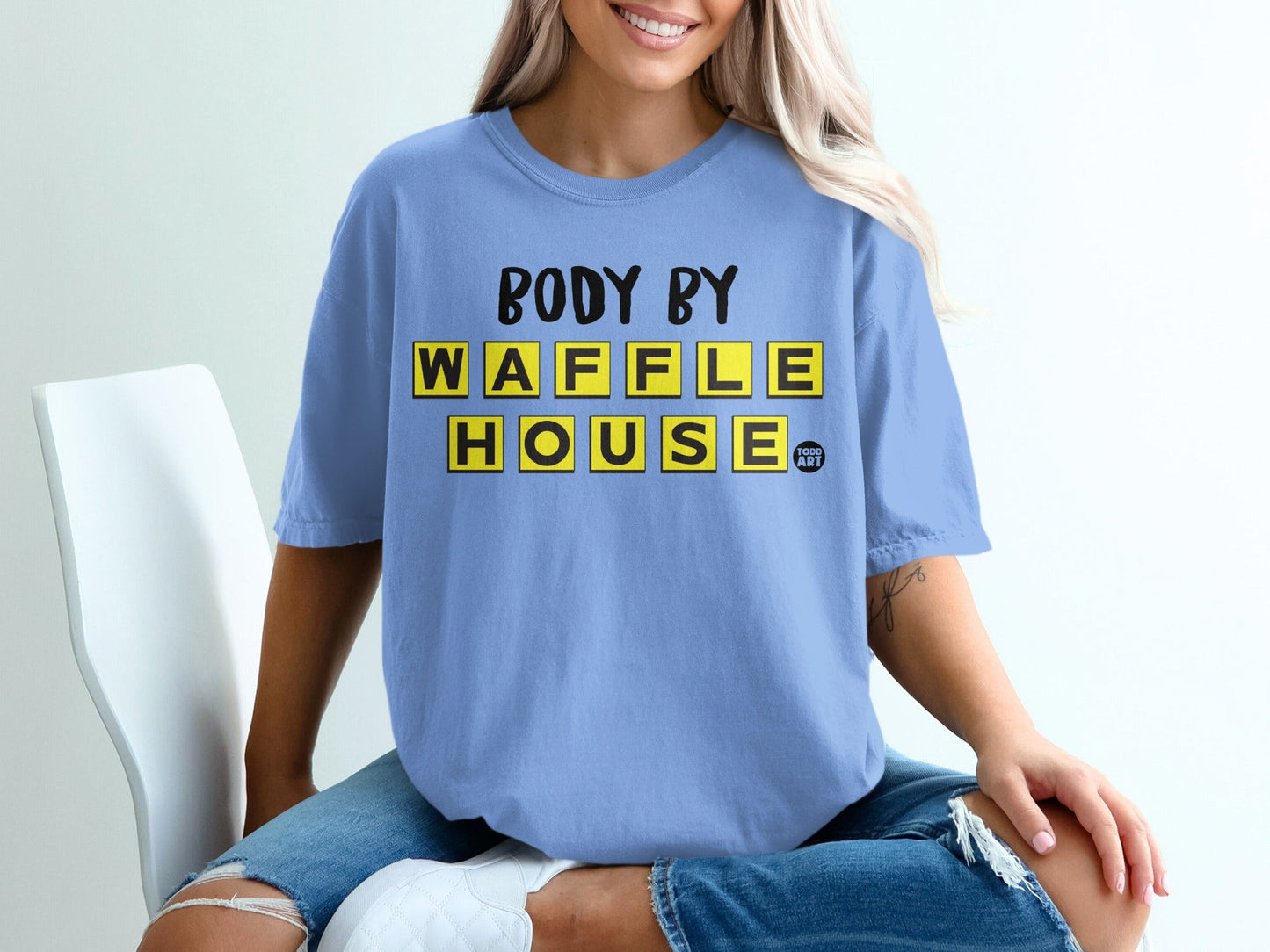 Blue t-shirt with "BODY BY WAFFLE HOUSE" in yellow block letters.