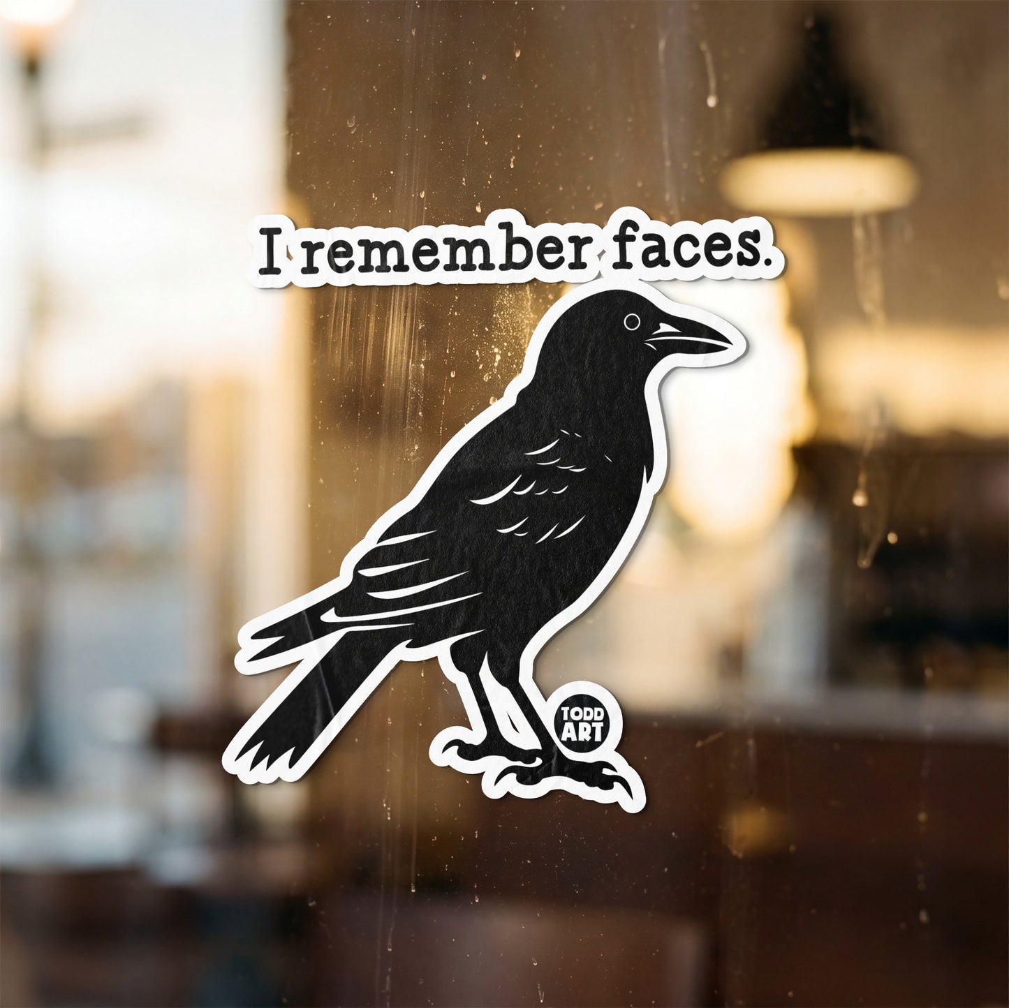 Black crow sticker with text "I remember faces. TODD ART."
