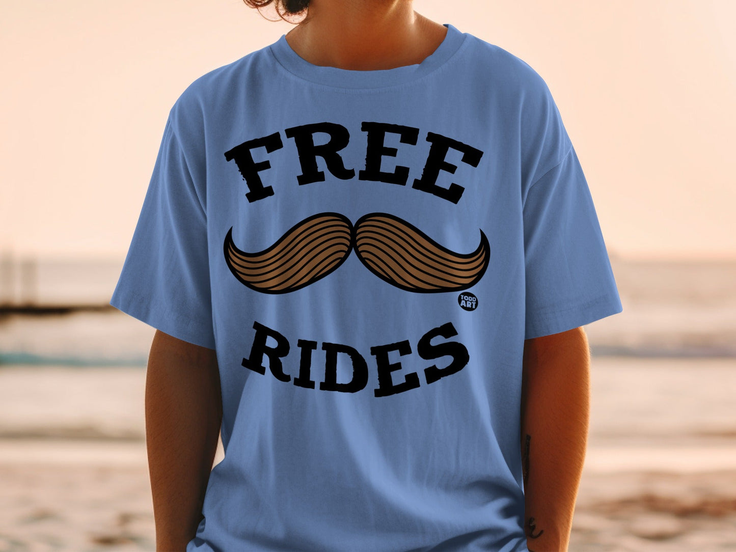 Blue t-shirt with "FREE RIDES" and a mustache graphic.